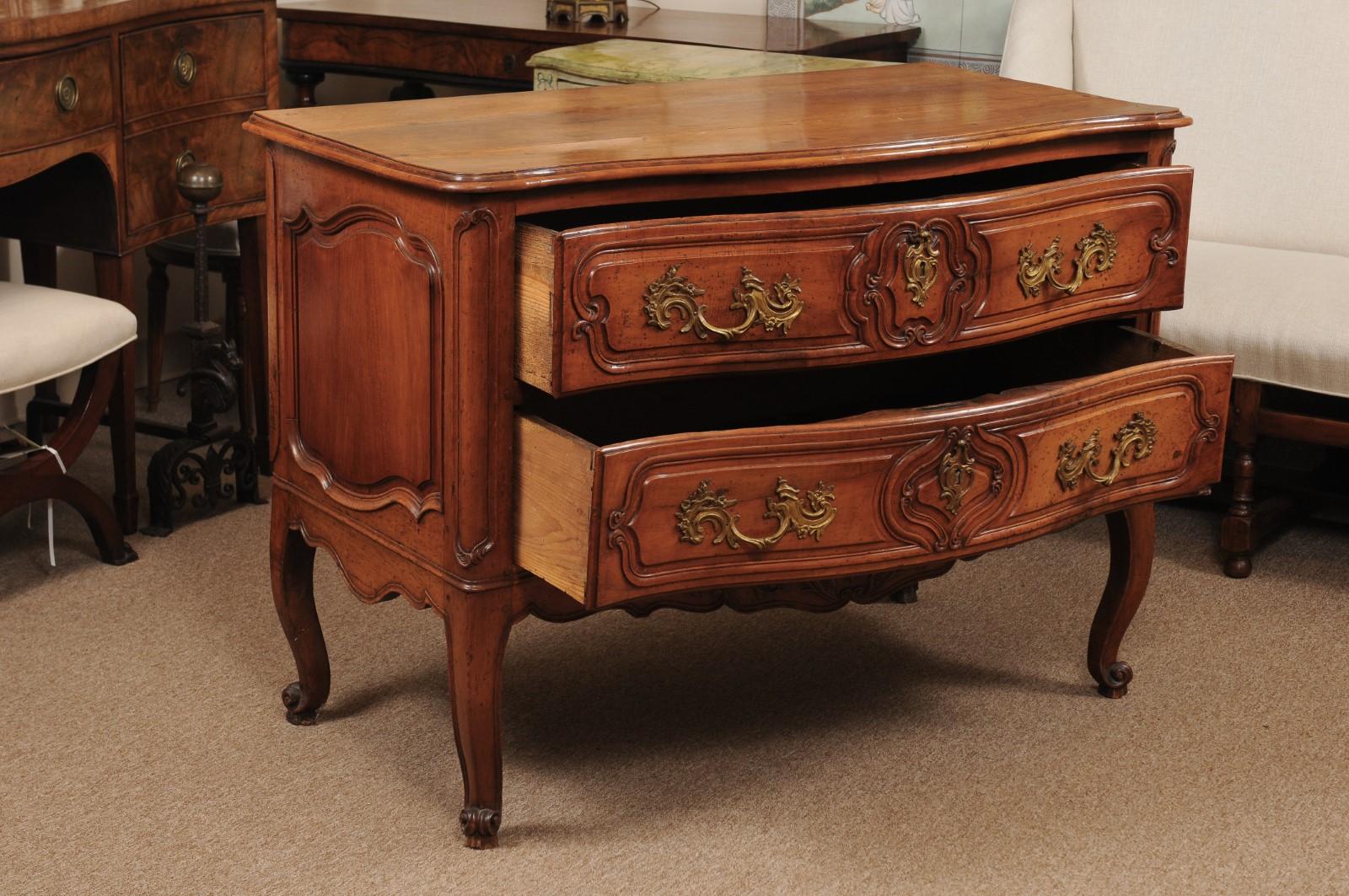 Early 18th Century French Regence Commode in Fruitwood with Carved Apron, Scroll Feet, & 2 Drawers.