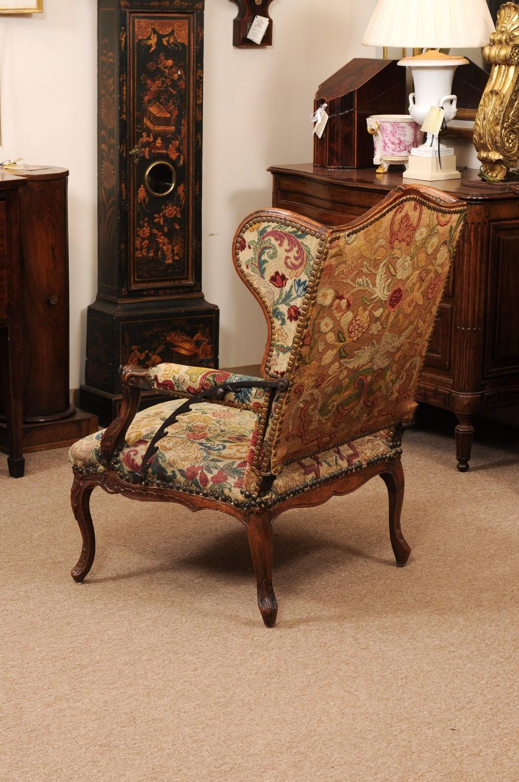Early 18th Century French Regence Period Walnut Ratchet Wing Chair with Needlewo For Sale 6