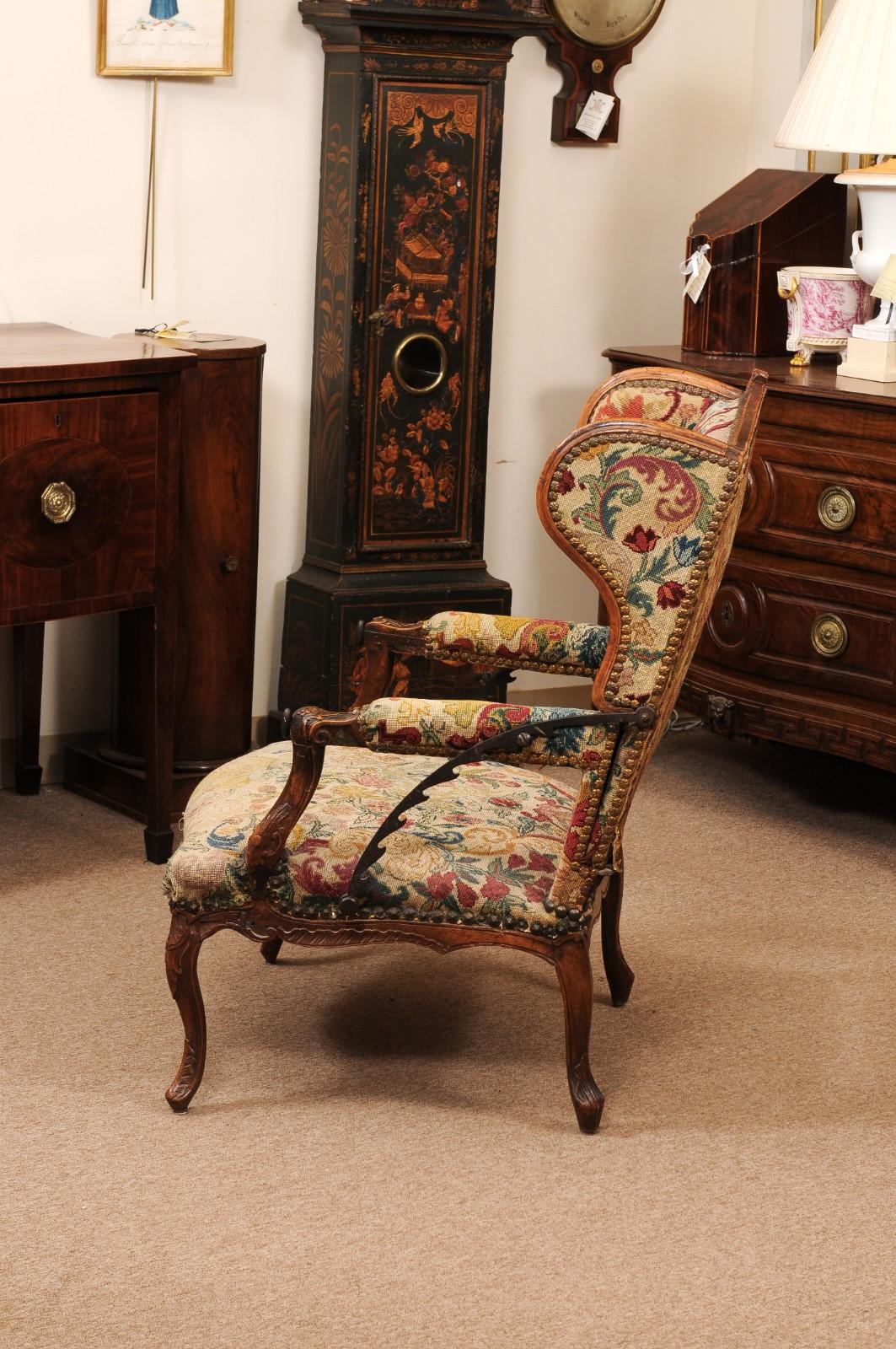 Early 18th Century French Regence Period Walnut Ratchet Wing Chair with Needlewo For Sale 7