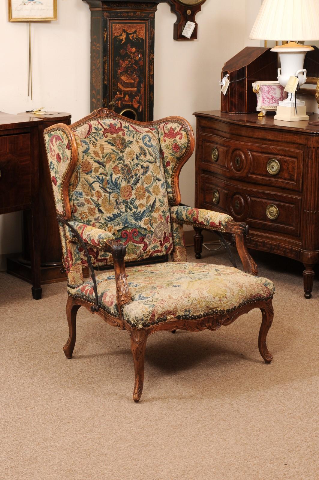 Early 18th Century French Regence Period Walnut Ratchet Wing Chair with Needlework Upholstery