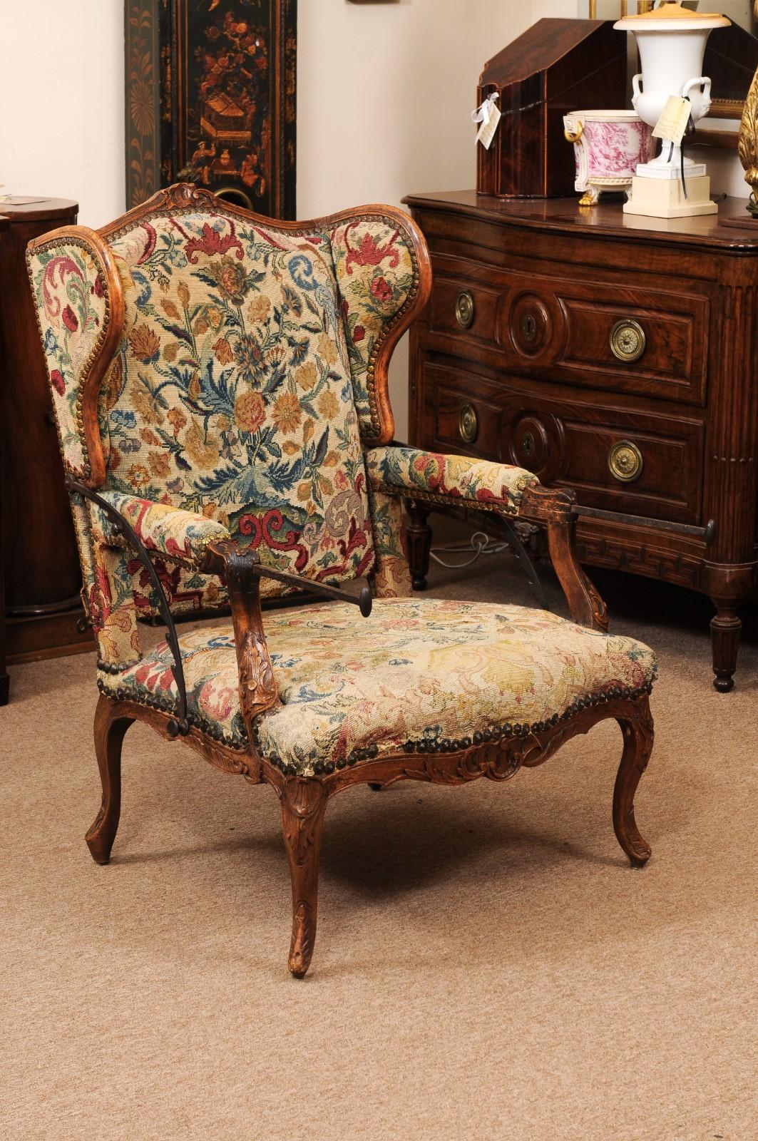 Early 18th Century French Regence Period Walnut Ratchet Wing Chair with Needlewo In Fair Condition For Sale In Atlanta, GA