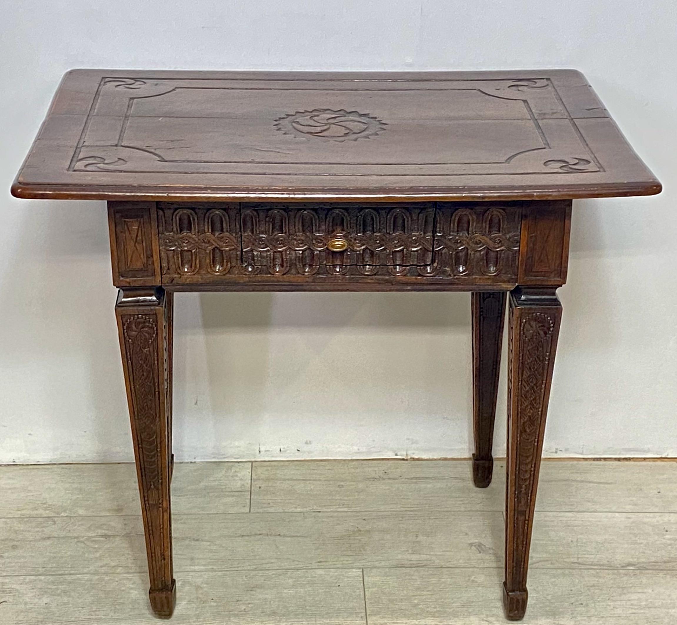 An exceptional early 18th century French Provencial style walnut side table, superbly carved with very old if not original finish.
Extensive and detailed relief carving all the way around including the legs.
In remarkable original condition with
