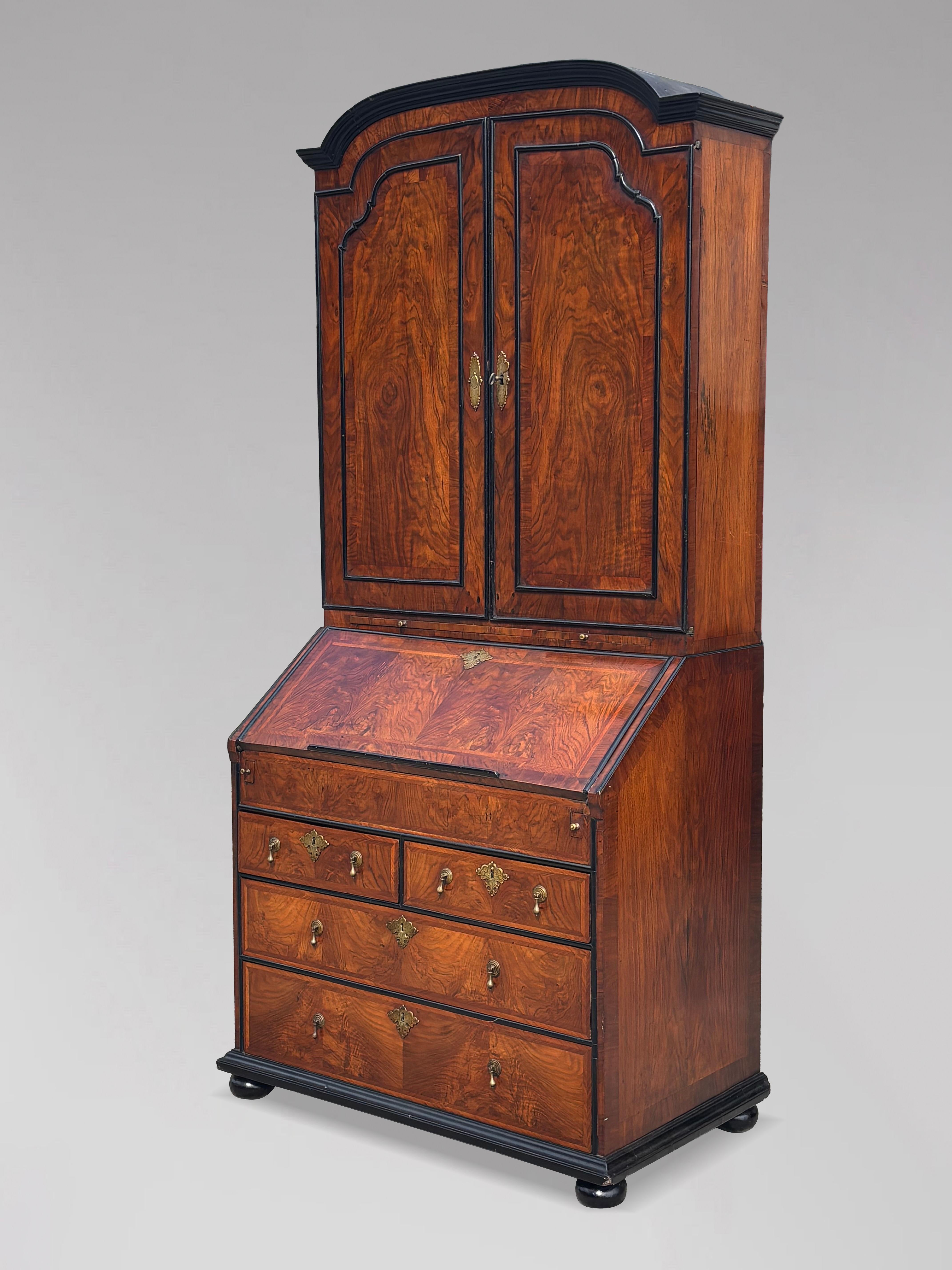 Superb Early 18th Century Burr Walnut Bureau Bookcase of the George I Period with Wonderful Original Patina

This wonderful bureau bookcase consists of an upper section with moulded cross grain cornice to the dome top leading down to two doors with