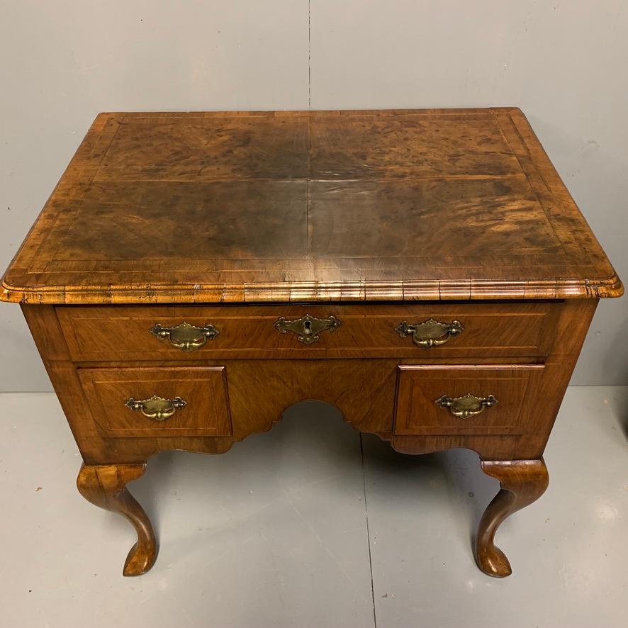 A beautifully proportioned and super quality George I walnut lowboy with three drawers, circa 1730 and in lovely condition, the most fabulous color and patina.
A good honest piece and all absolutely as you would hope to find it, from the end grain