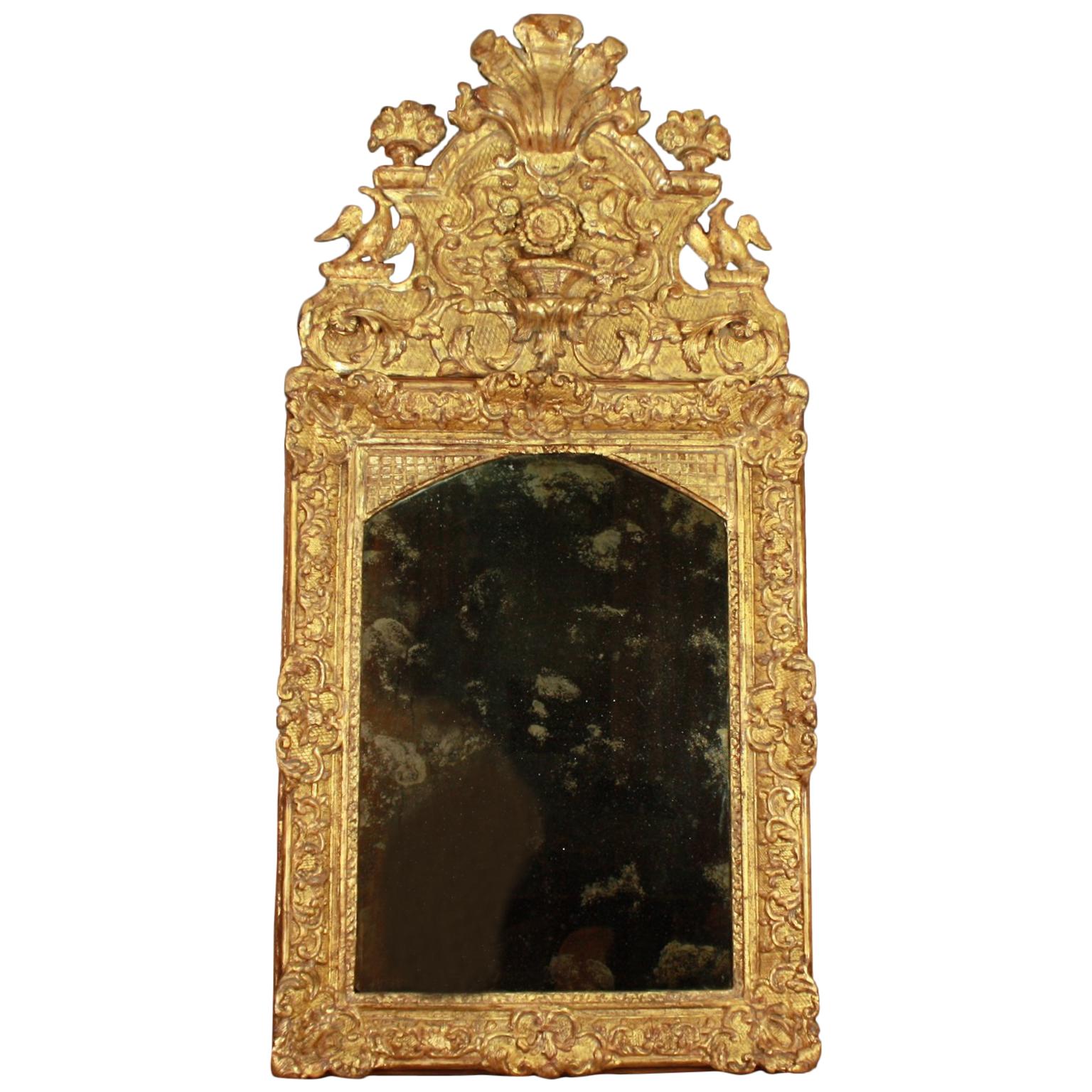 French Early 18th Century Régence Vase and Birds Cresting Giltwood Mirror