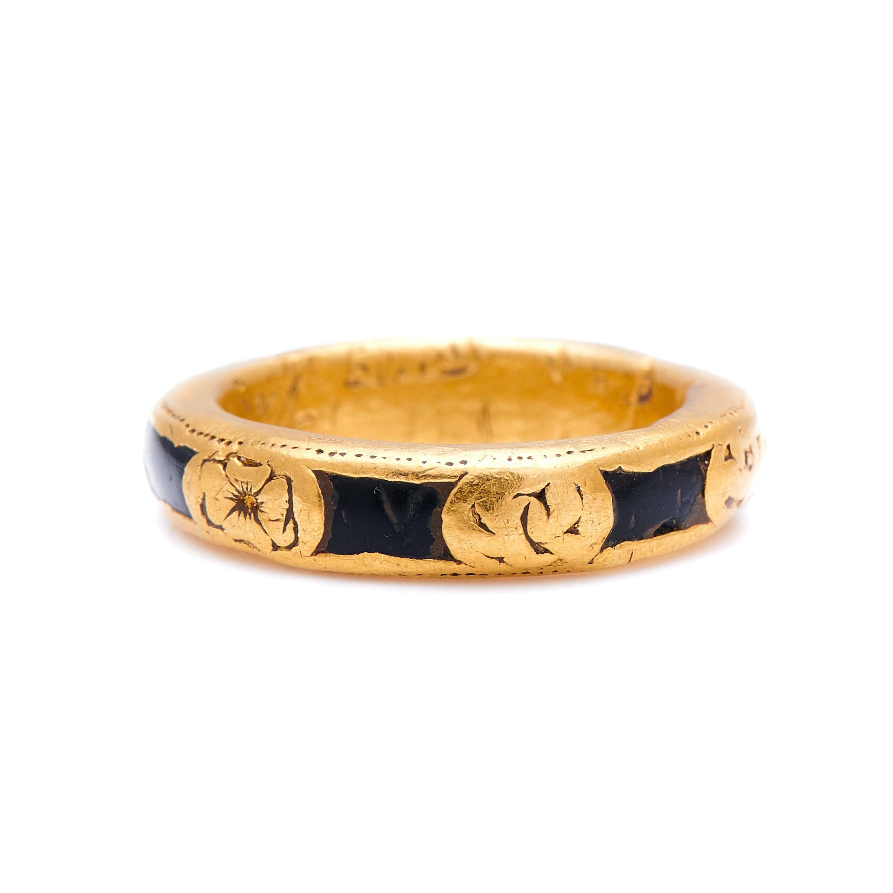 Gold, enamel ring, circa 1750. An exceptional, fine quality memento mori ring detailed with enamel and carved a skull, a rose and pumpkin heads. It’s a truly exceptional, and rare, piece of history in remarkable condition. The gold has tarnished