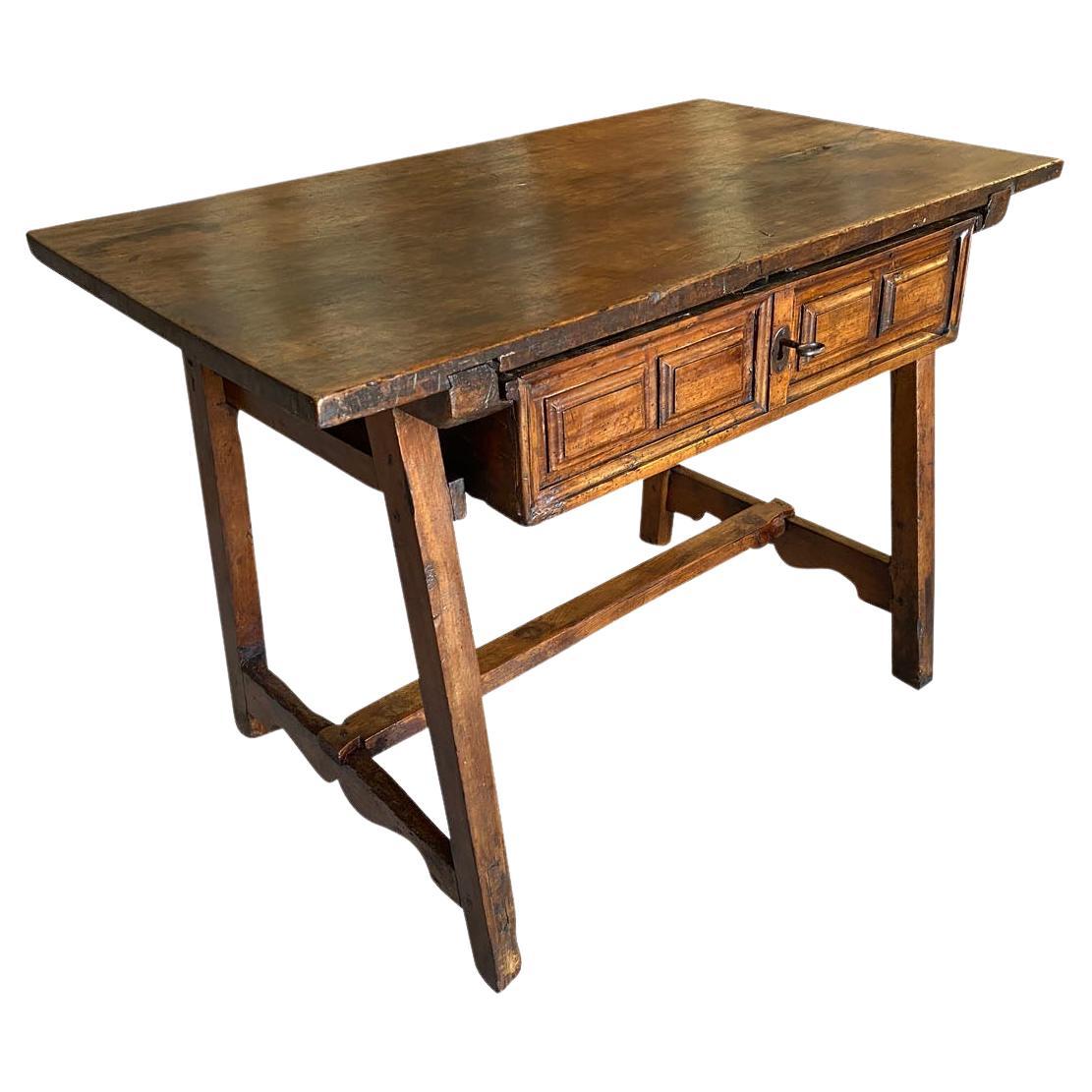 A very handsome early 18th century Italian Side Table - Writing Table.  Beautifully constructed from walnut with a wonderful solid board top, a single drawer and slightly splayed legs.  Excellent patina - warm and luminous. 