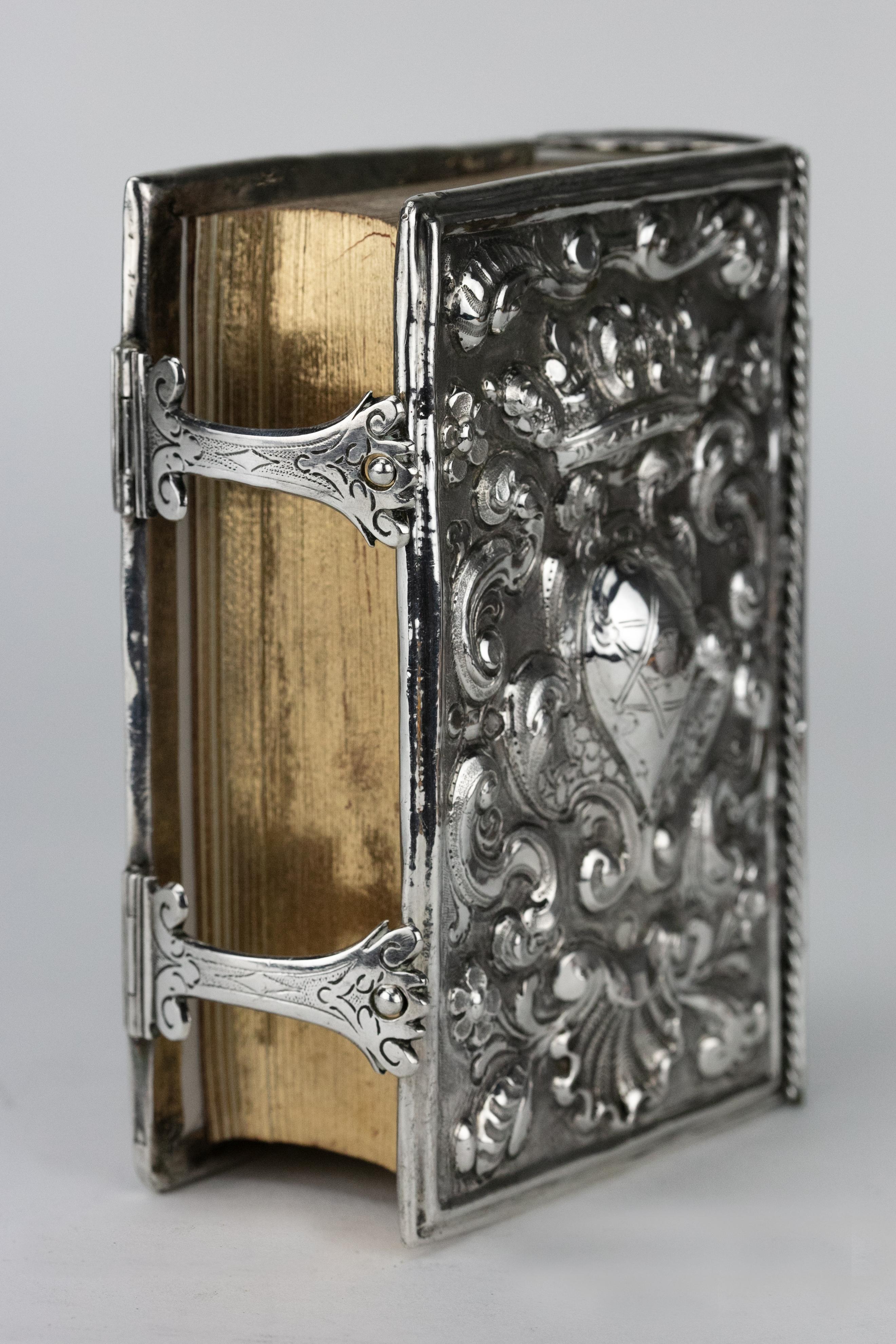 Hand-embossed Judaic book binding, Venice, Italy, circa 1700.
Both covers bolding embossed with armorials below coronets framed by scrolls, flowers, and a shell, spine chased to match, on matted ground.

Every item in Menorah Galleries is