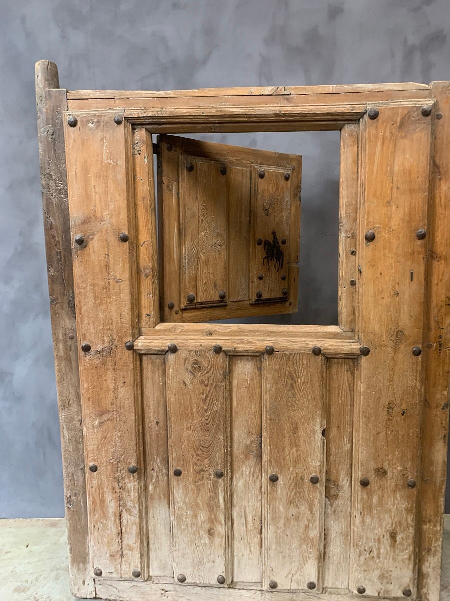 A completely original stunning early 18th century Italian stable door. Made from mountain pine and oak this door was rescued from a demolished Napolitan stud farm. It is still in great condition with lots of paina and all the original hardware. Nice