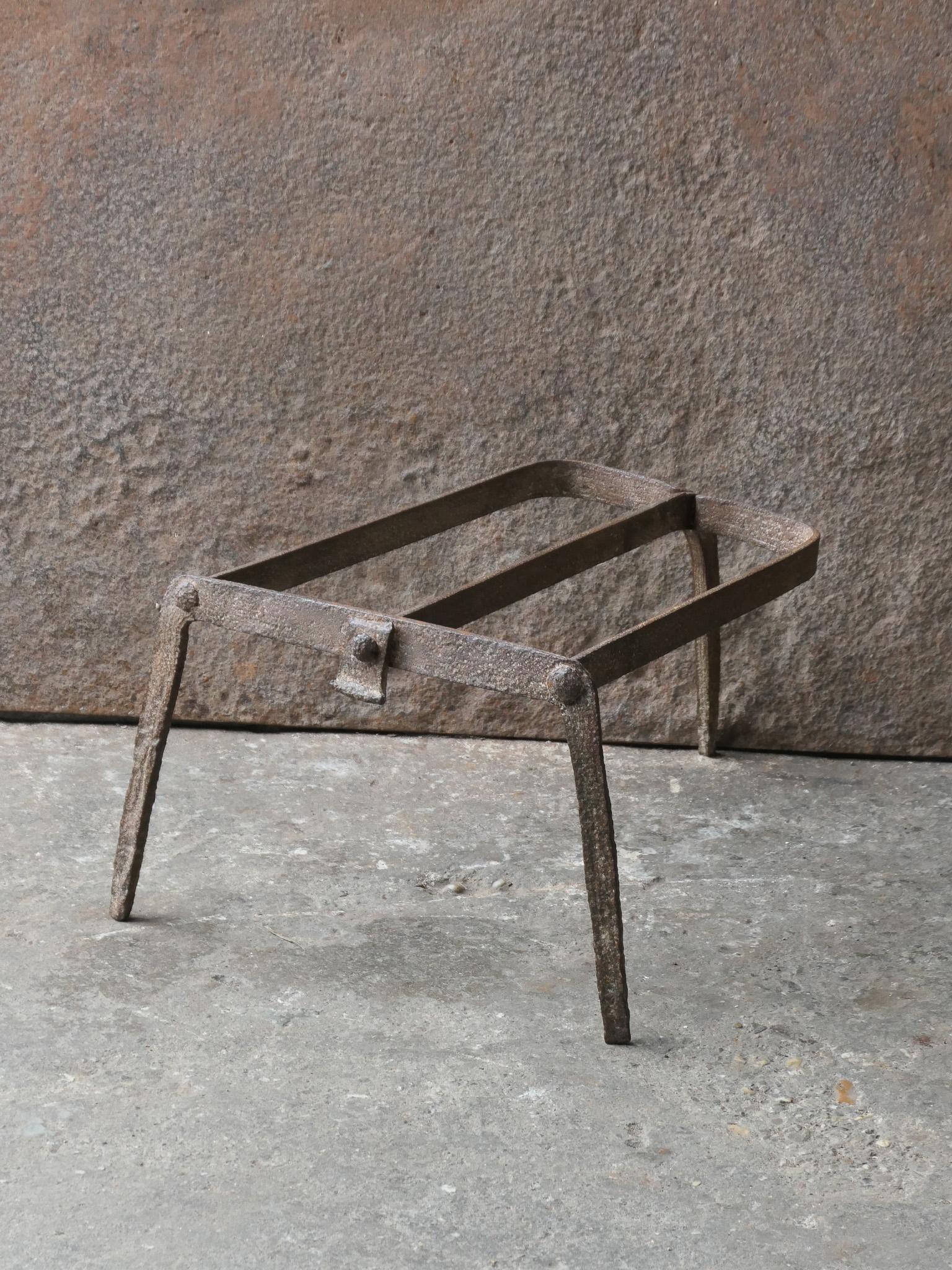 17th century French Louis XIV Style trivet. 

It is used for heating up a pan or to keep it warm in front of the fire. In a good working condition.