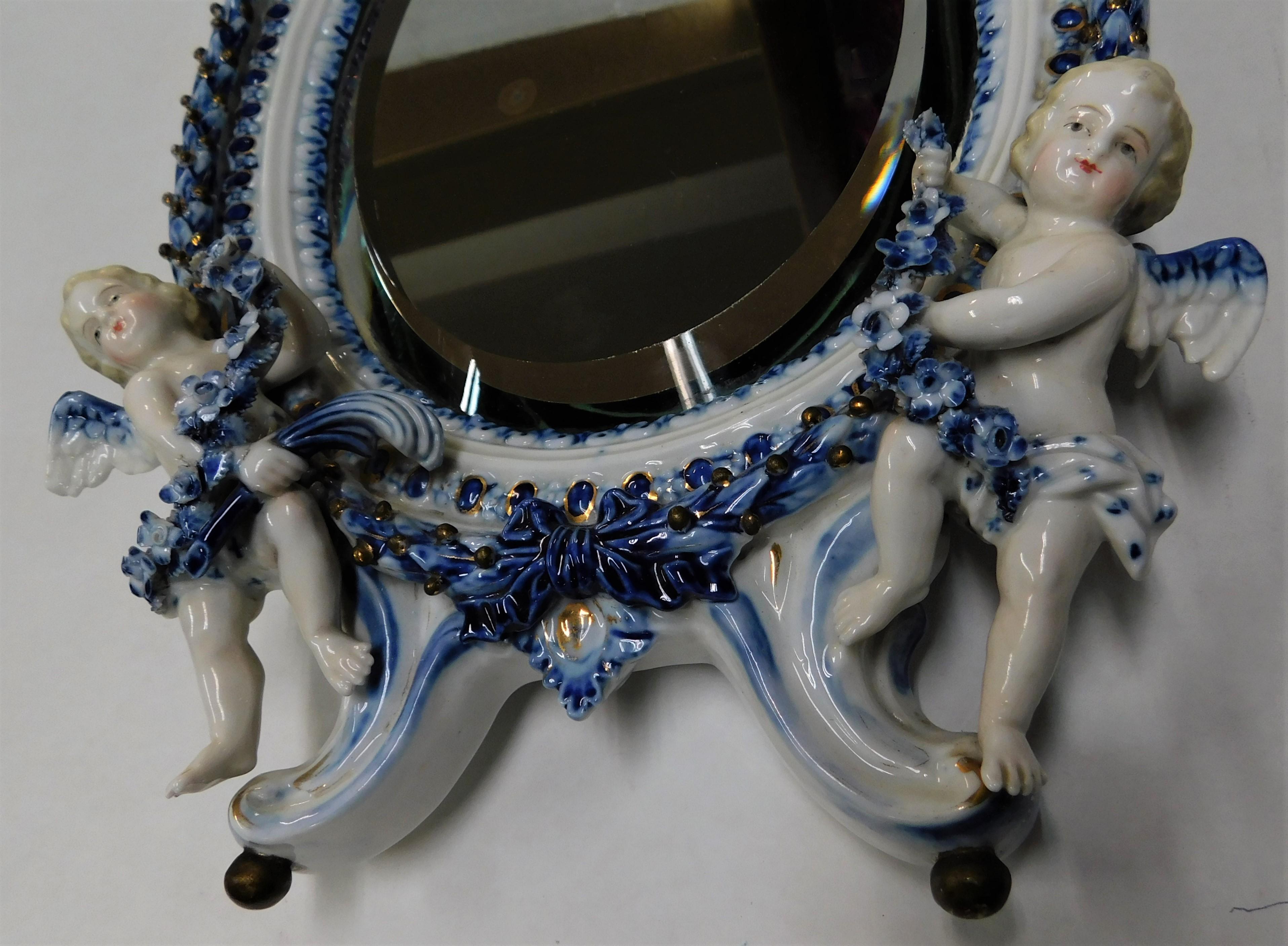 Rococo Early 18th Century Meissen Oval Wall Beveled Mirror Pair of Cherubs, Germany For Sale