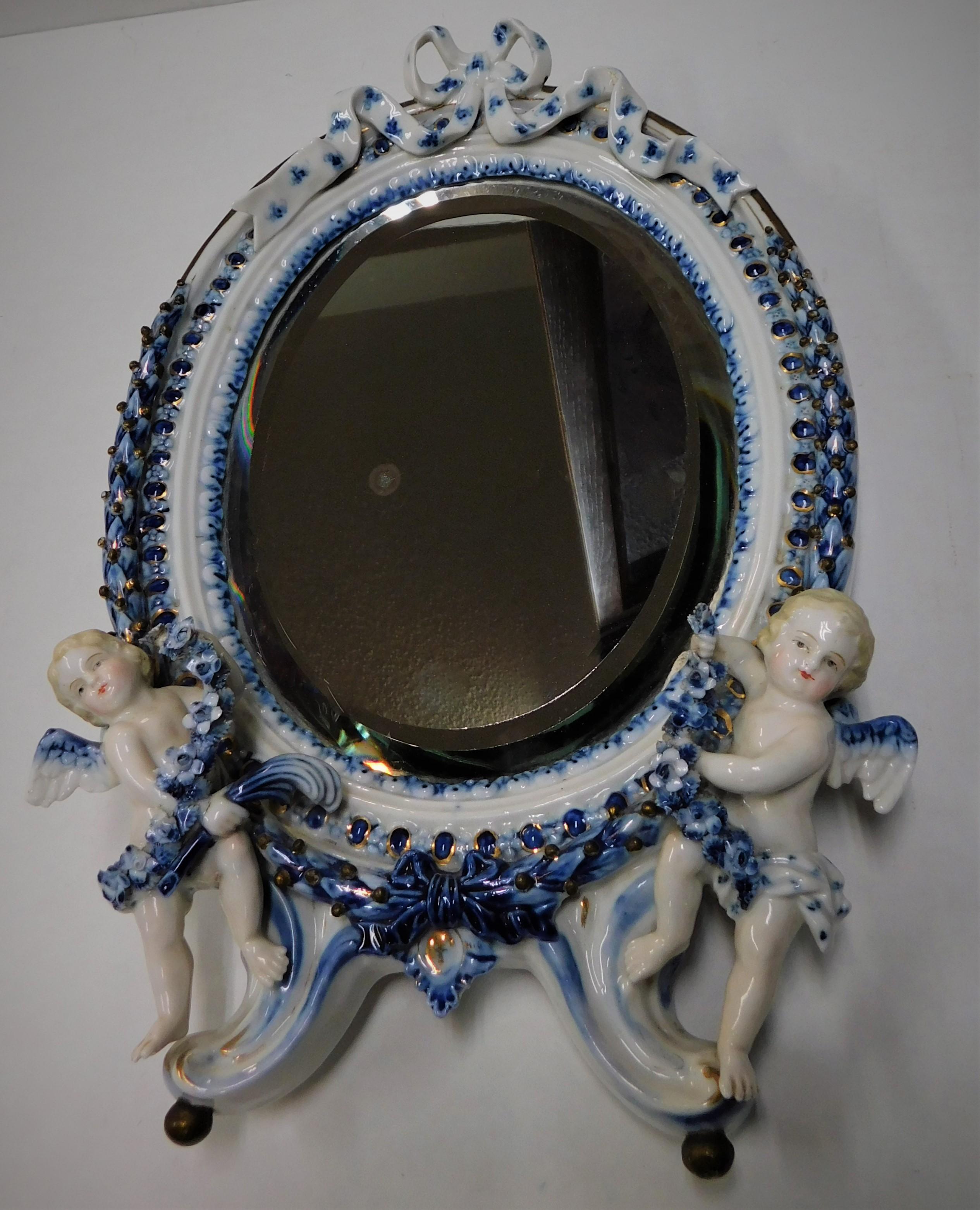 Porcelain Early 18th Century Meissen Oval Wall Beveled Mirror Pair of Cherubs, Germany For Sale