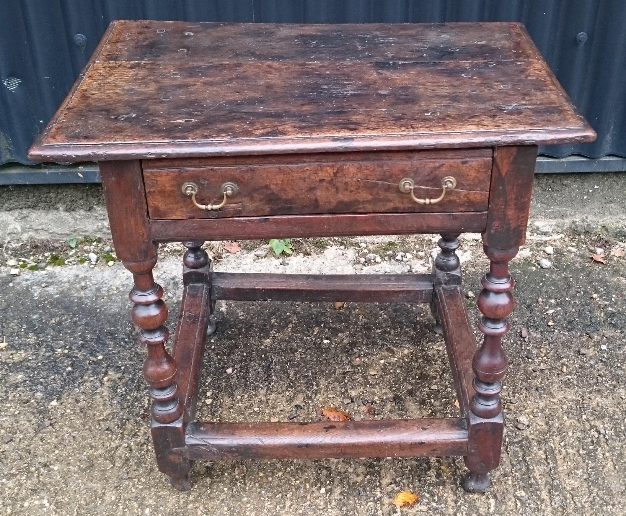 Lovely small scale early 18th century oak antique side table with a drawer in the frieze and stretchers between the legs. This is a really charming little table with great colour and patina which will improve further when we have polished it with