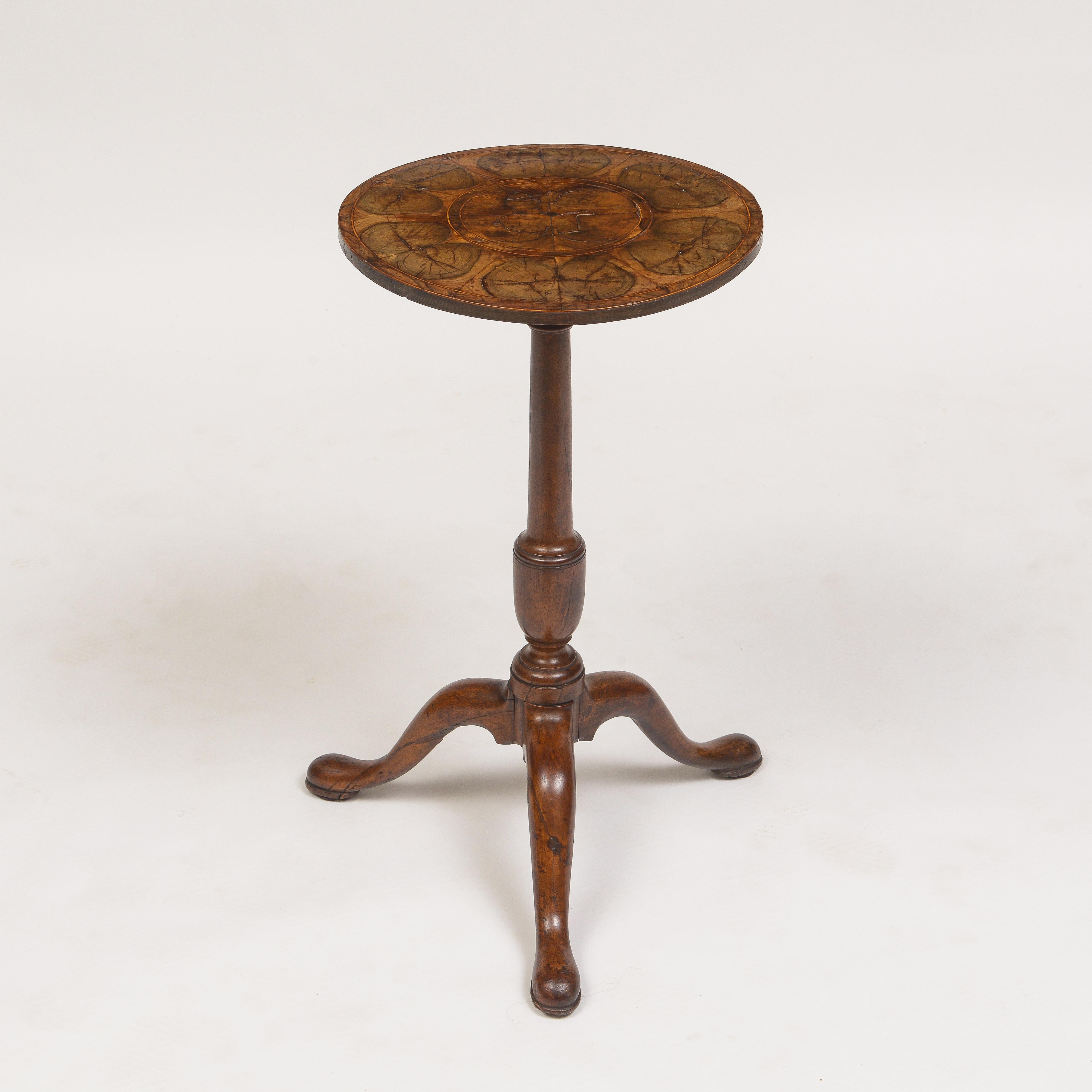 Beautiful oyster-wood and box wood inlayed top supported with a walnut tripod base.