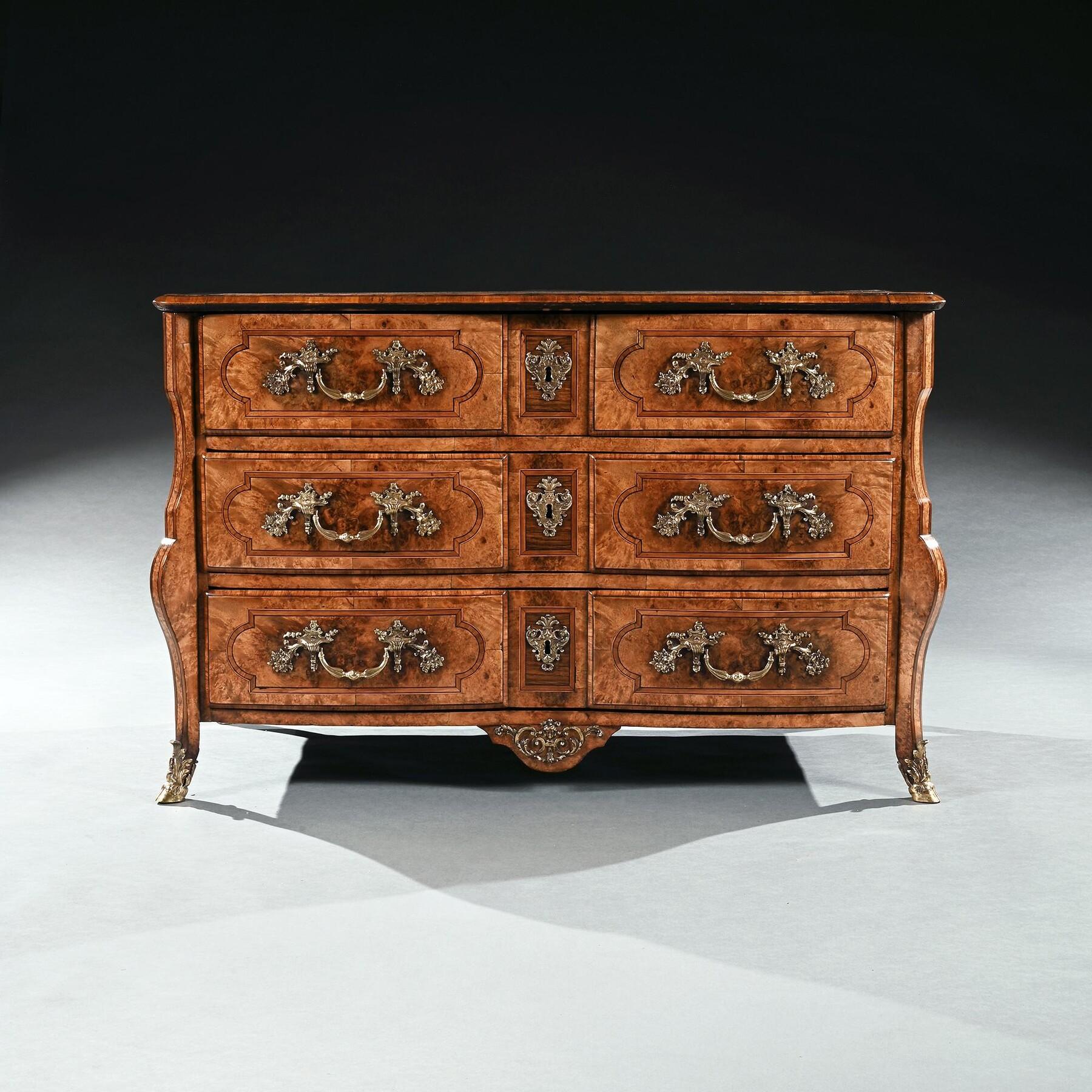 An Exceptionally Fine Early 18th Century French Regence Commode Attributed to Thomas Hache of Grenoble 



French Circa - 1720



The rectangular moulded geometrically top banded with kingwood and strung boxwood with burr maple top set upon a very