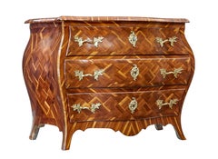 Early 18th century Rococo inlaid plum bombe chest of drawers