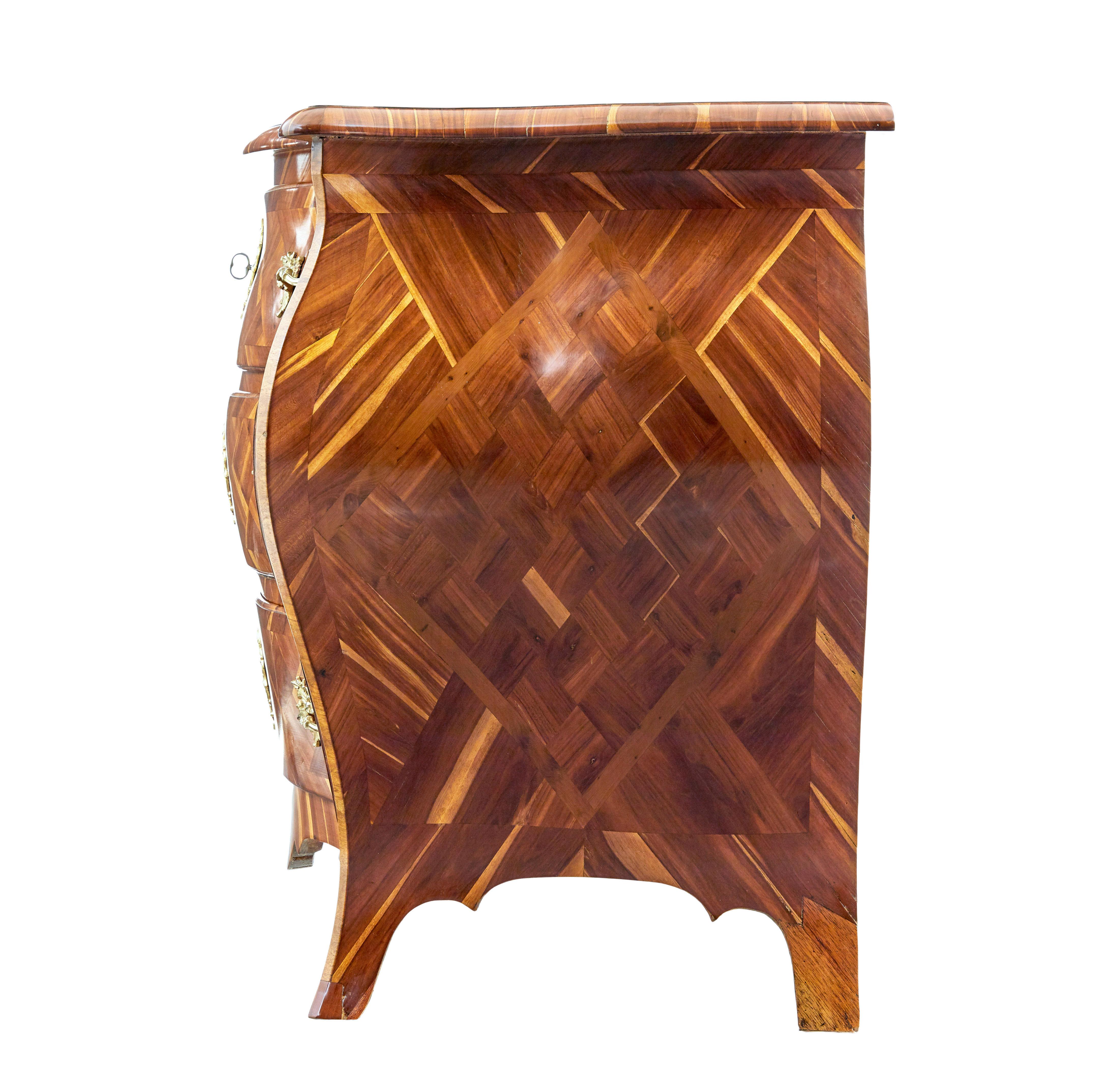 Swedish Early 18th century Rococo inlaid plum bombe chest of drawers