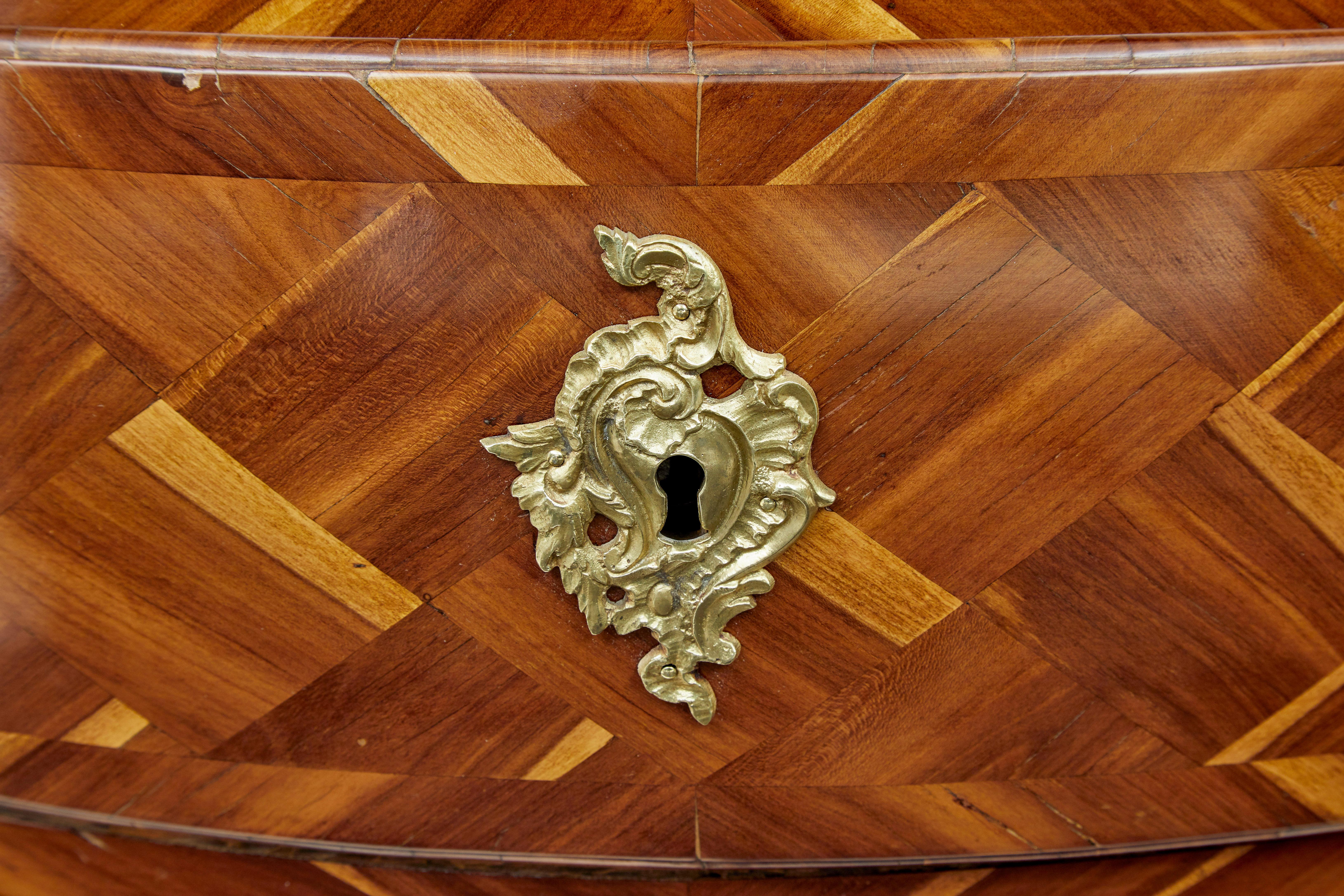 Early 18th century Rococo inlaid plum bombe chest of drawers 1