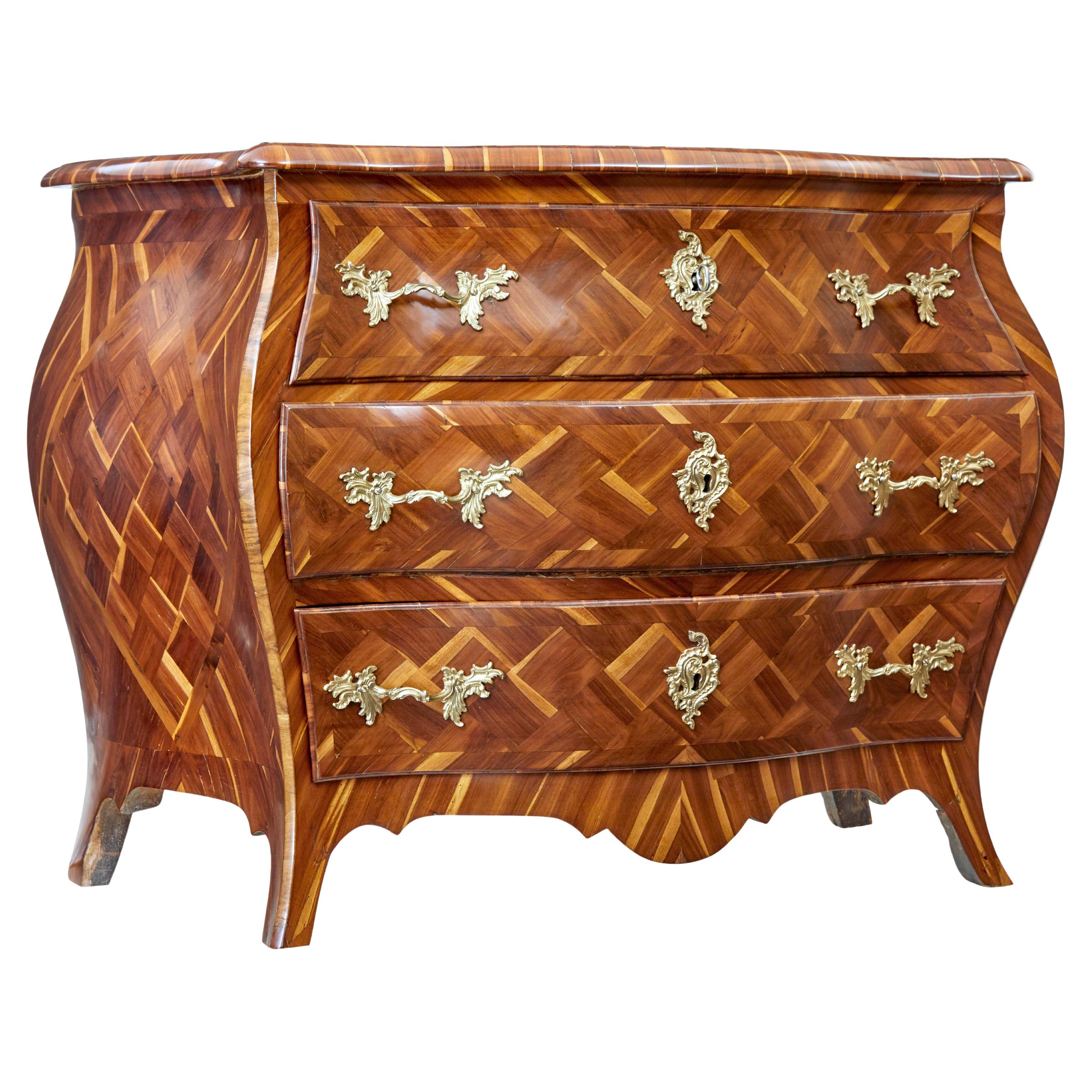Early 18th Century rococo inlaid plum bombe chest of drawers For Sale