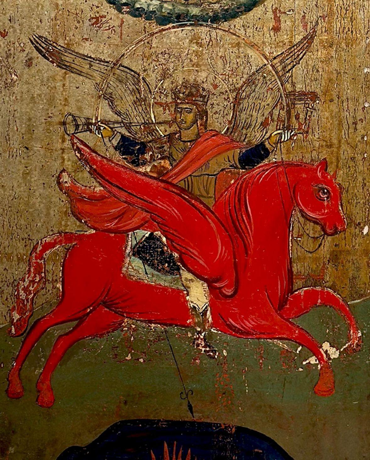 A traditional Russian icon of St Michael-Archangel of the Apocalypse, with two saints on the borders (St. Nicholas on the left and St. Marina). On top of the icon amid the clouds appears Christ Emmanuel before the Hetoimasia. St. Michael appears