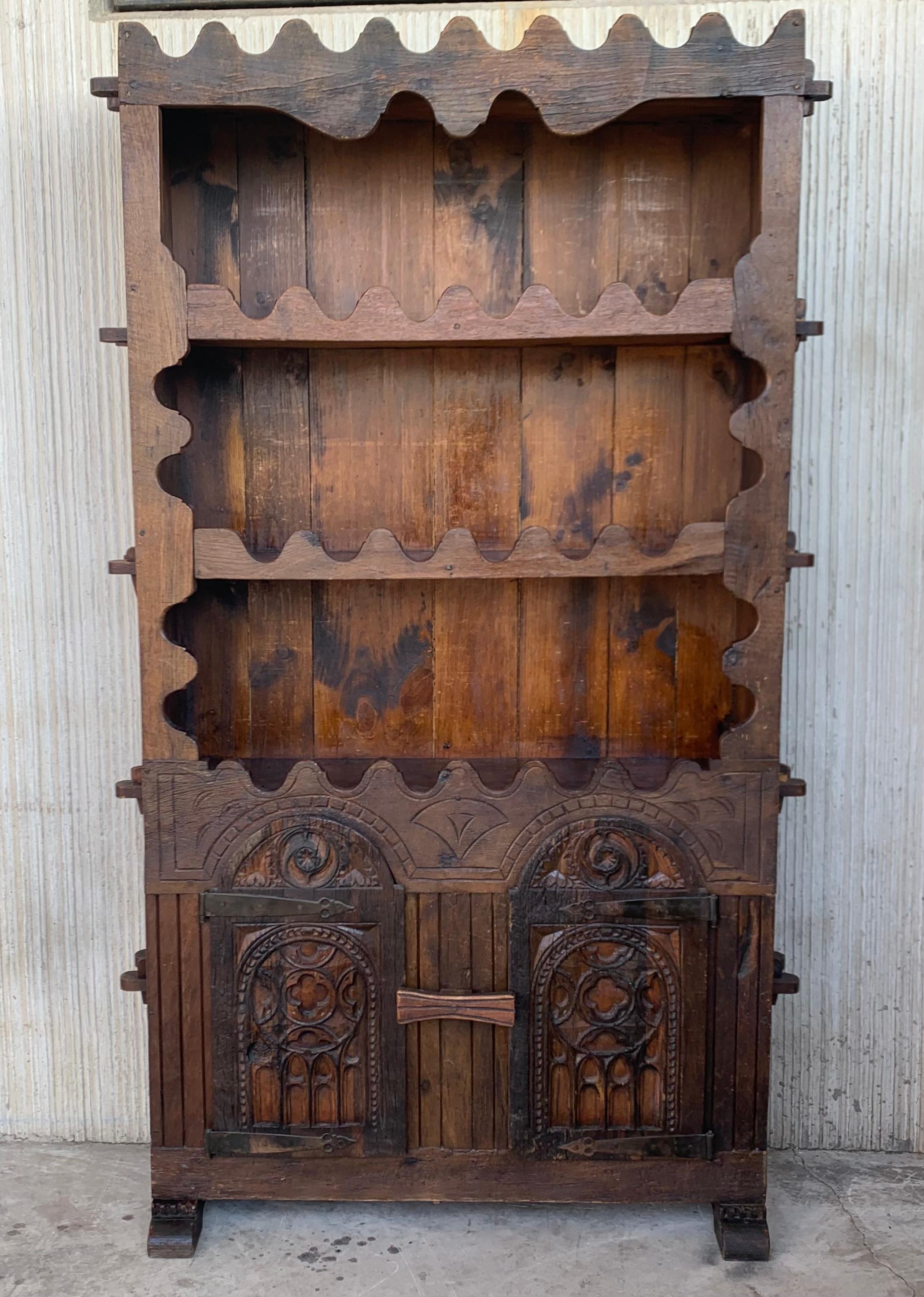 Early 18th century Rustic Spanish open bookcase is a relic from the distant past, ready to serve your family for generations yet to come! Hand-hewn from old-growth timbers of solid oak, it was produced using time-honored techniques of full mortise &