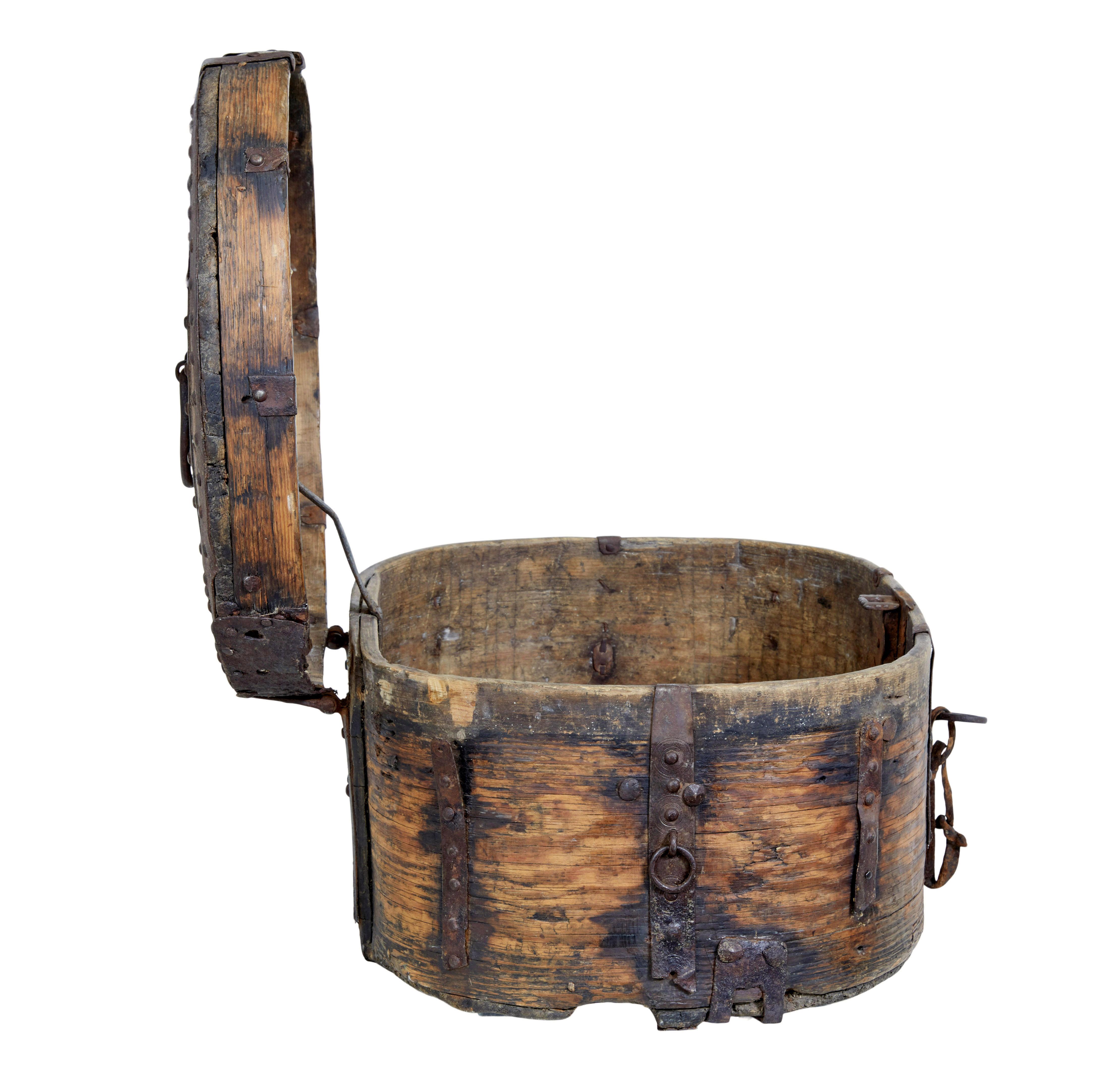 Mid 18th century Scandinavian baroque oak iron bound box circa 1720.

Characterful oval shaped box profusely covered with iron edging and strap work.  This piece has taken on a great patina.  Lid opens to reveal the original still fully functioning