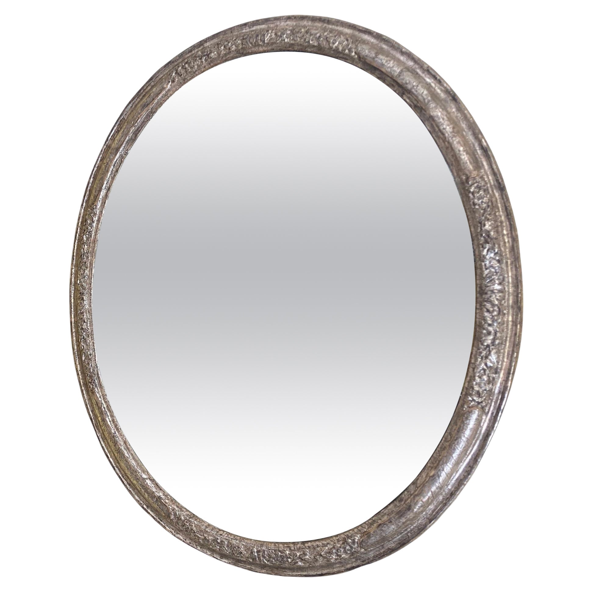 Miroir ovale en argent doré du début du 18e siècle