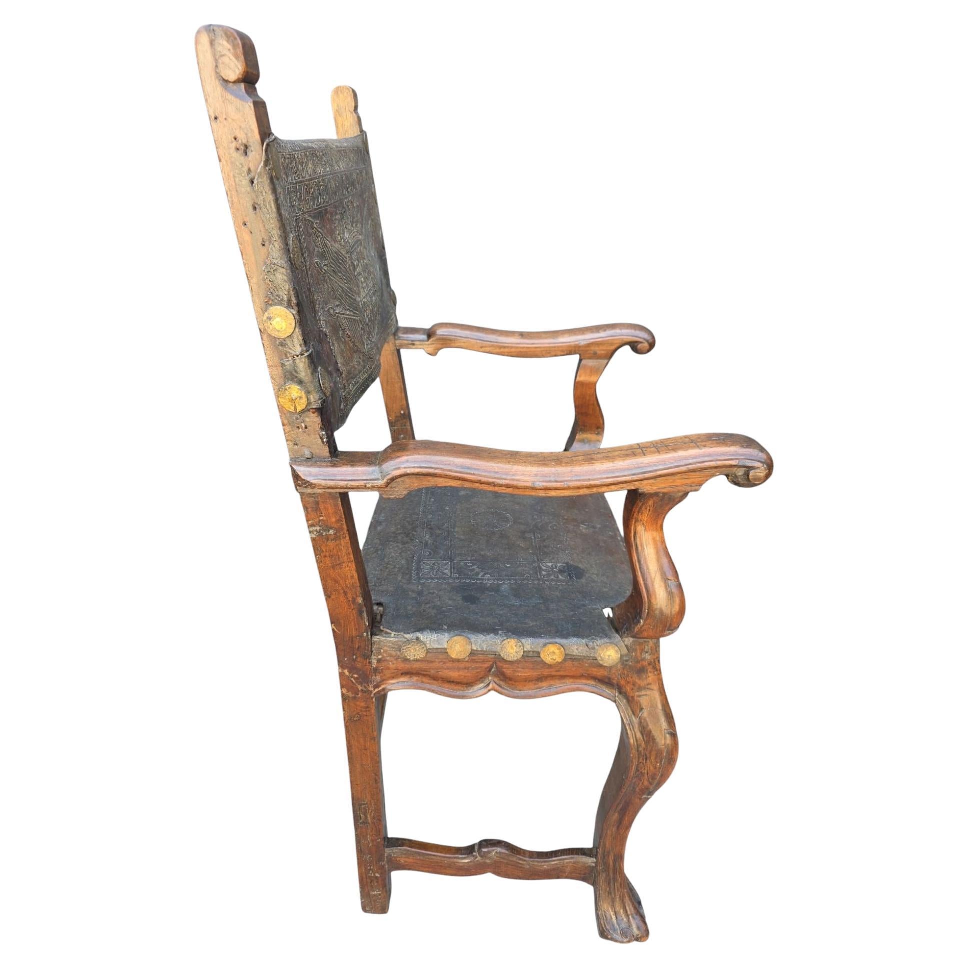 Pair of late 17th Century to early 18th Century Spanish arm chairs.  Similar pair.  Original embossed leather.  In excellent condition.