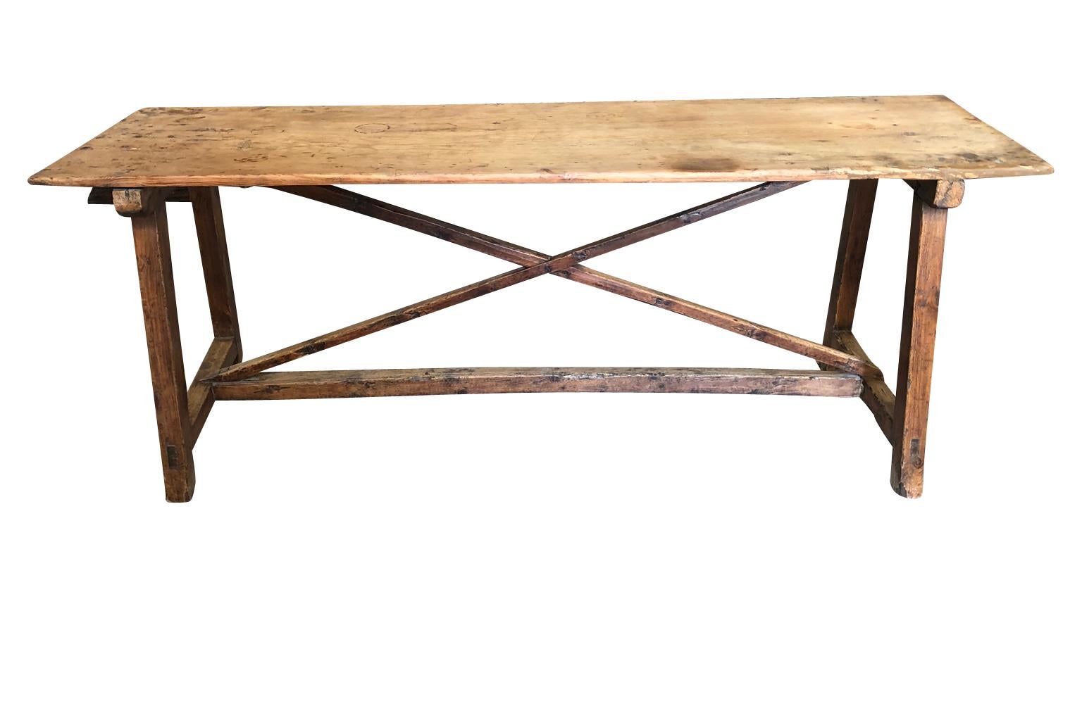 A very handsome early 18th century console table from Spain. Soundly constructed from beautifully patina'd pine with a solid board top. Wonderful minimalist design. Also serves wonderfully as a narrow dining table or desk.