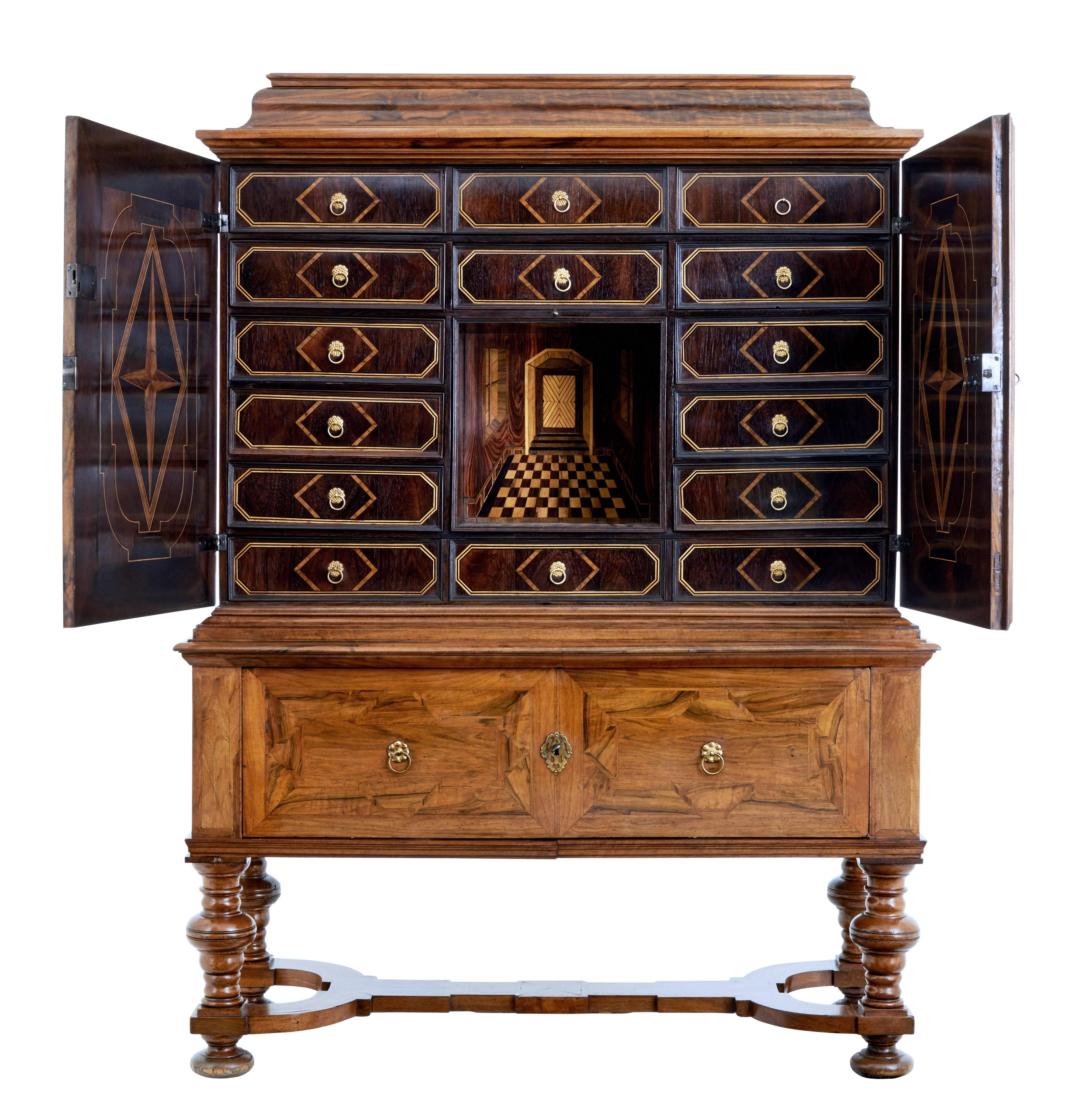 Rare and fine quality baroque period walnut cabinet on stand, circa 1710.

Comprising of 2 sections, top section with secret compartment in the cornice which opens to reveal an open deep storage aperture, finished with an inlaid hinged door.