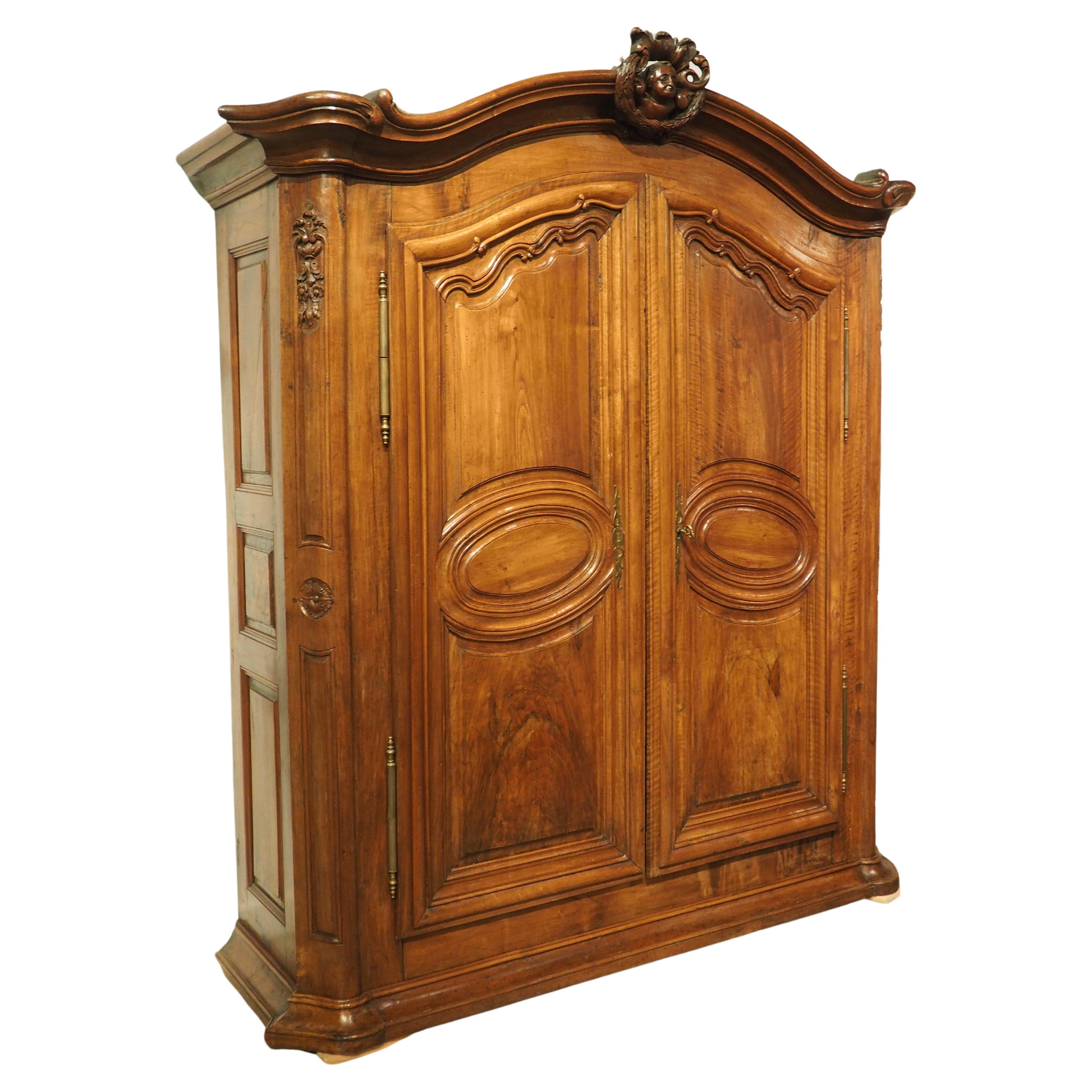 Early 18th Century Walnut and Olive Wood Armoire from Eastern France For Sale