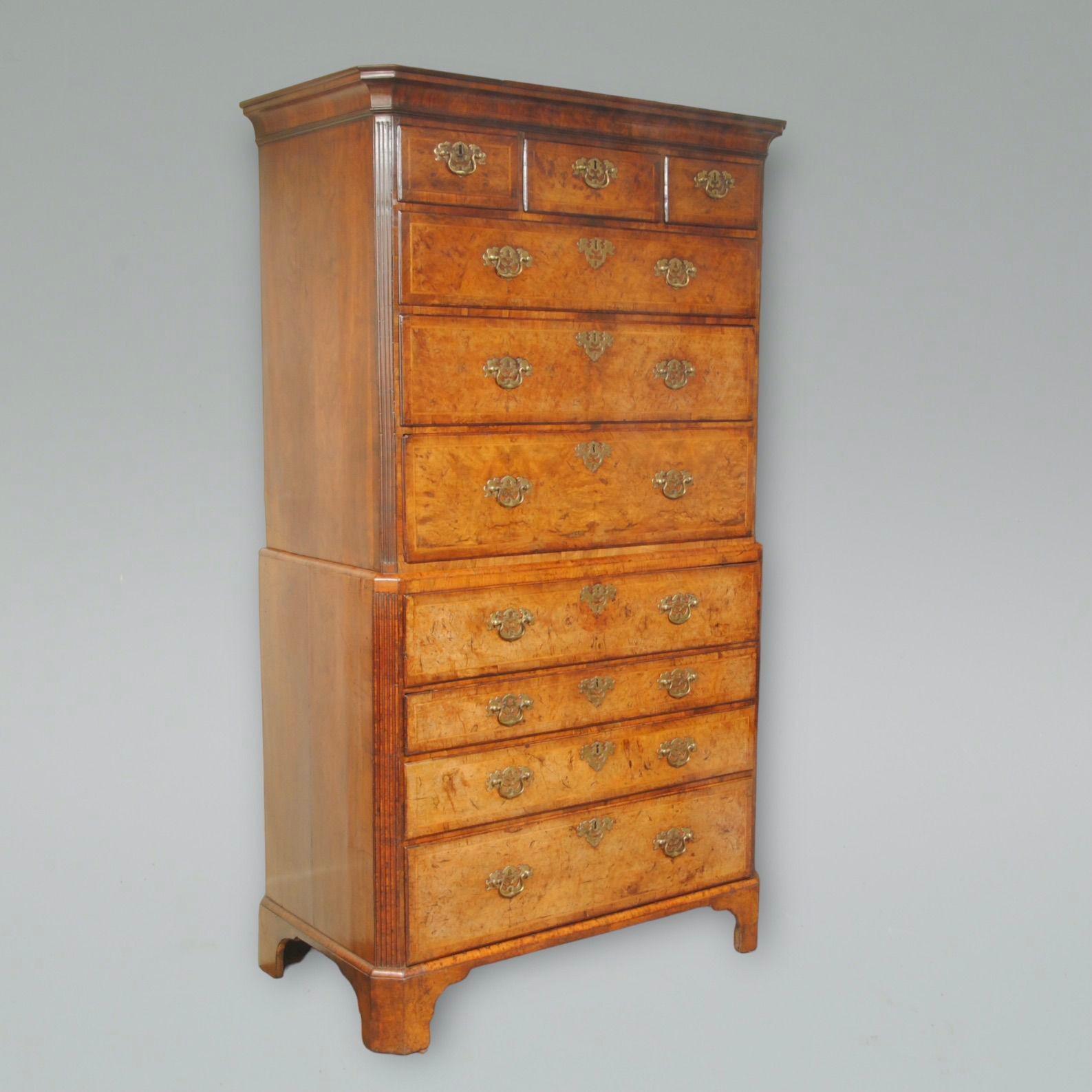 An 18th century burr walnut secretaire chest on chest with original brass handles and canted corners to both parts.
The secretaire drawer with fitted interior 
circa 1725.