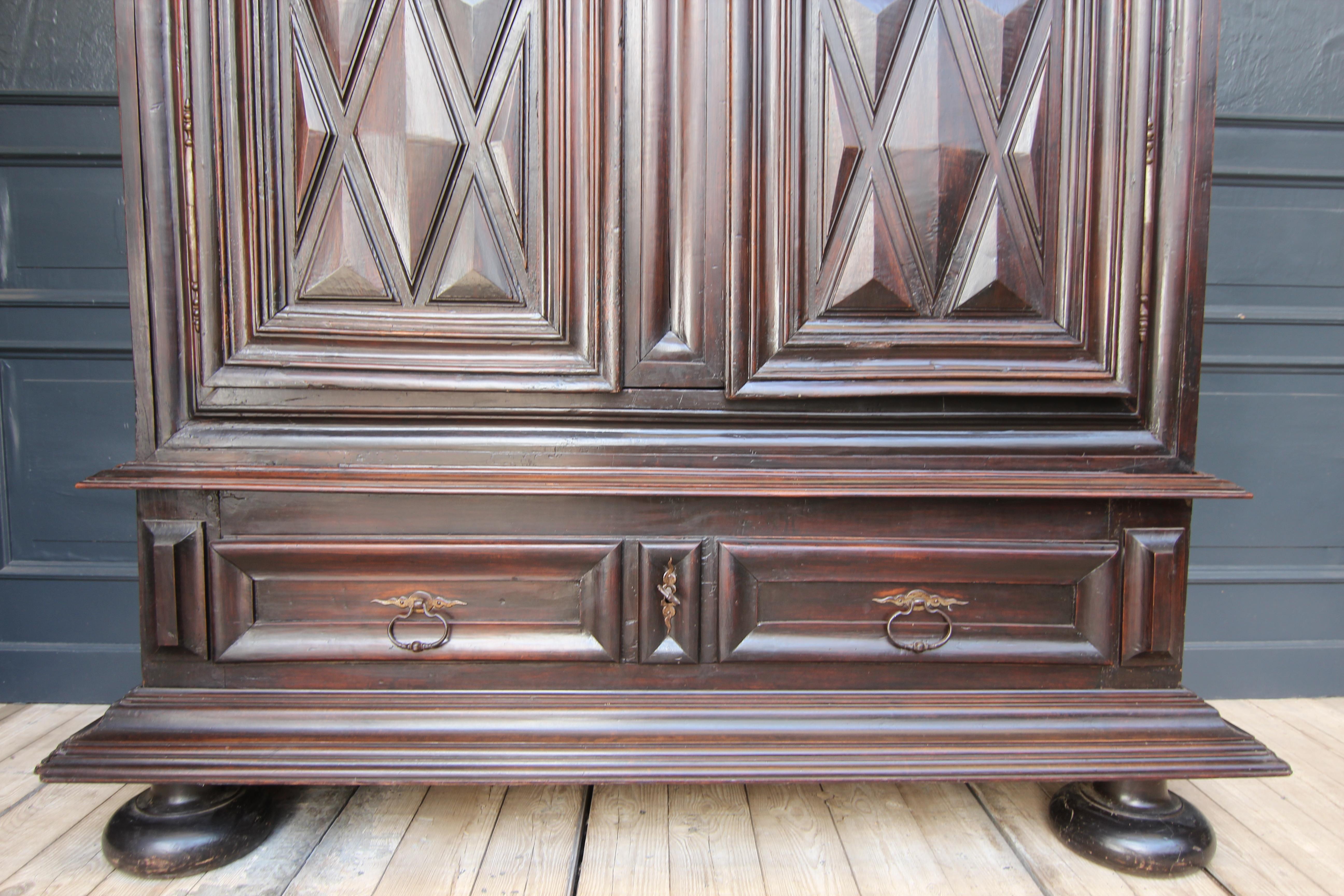 Wood Early 18th Century Walnut Louis XII Armoire with Carved Diamond Point Panels