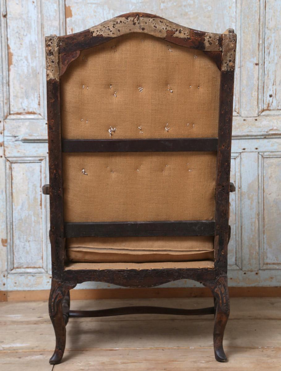 Baroque Revival Early 18th Century French Deconstructed High Wing Back Fruitwood Armchair For Sale