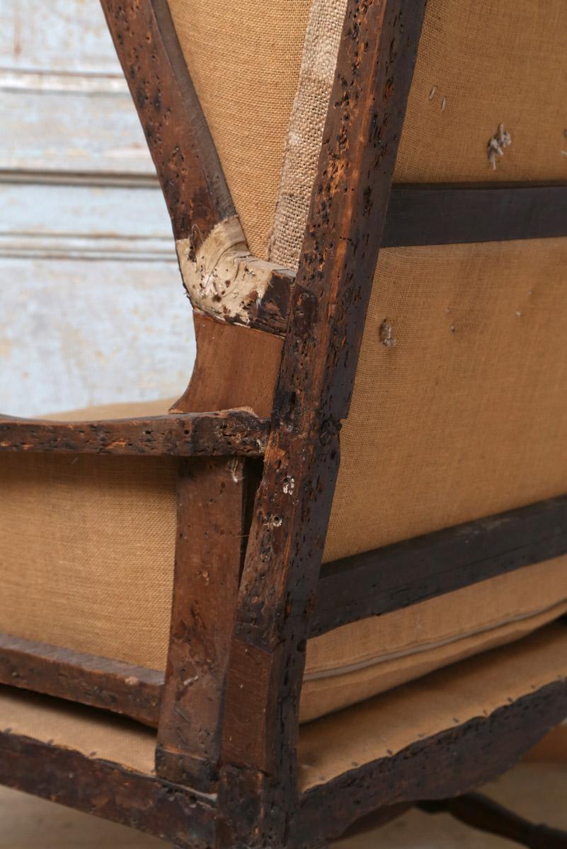 Wood Early 18th Century French Deconstructed High Wing Back Fruitwood Armchair For Sale