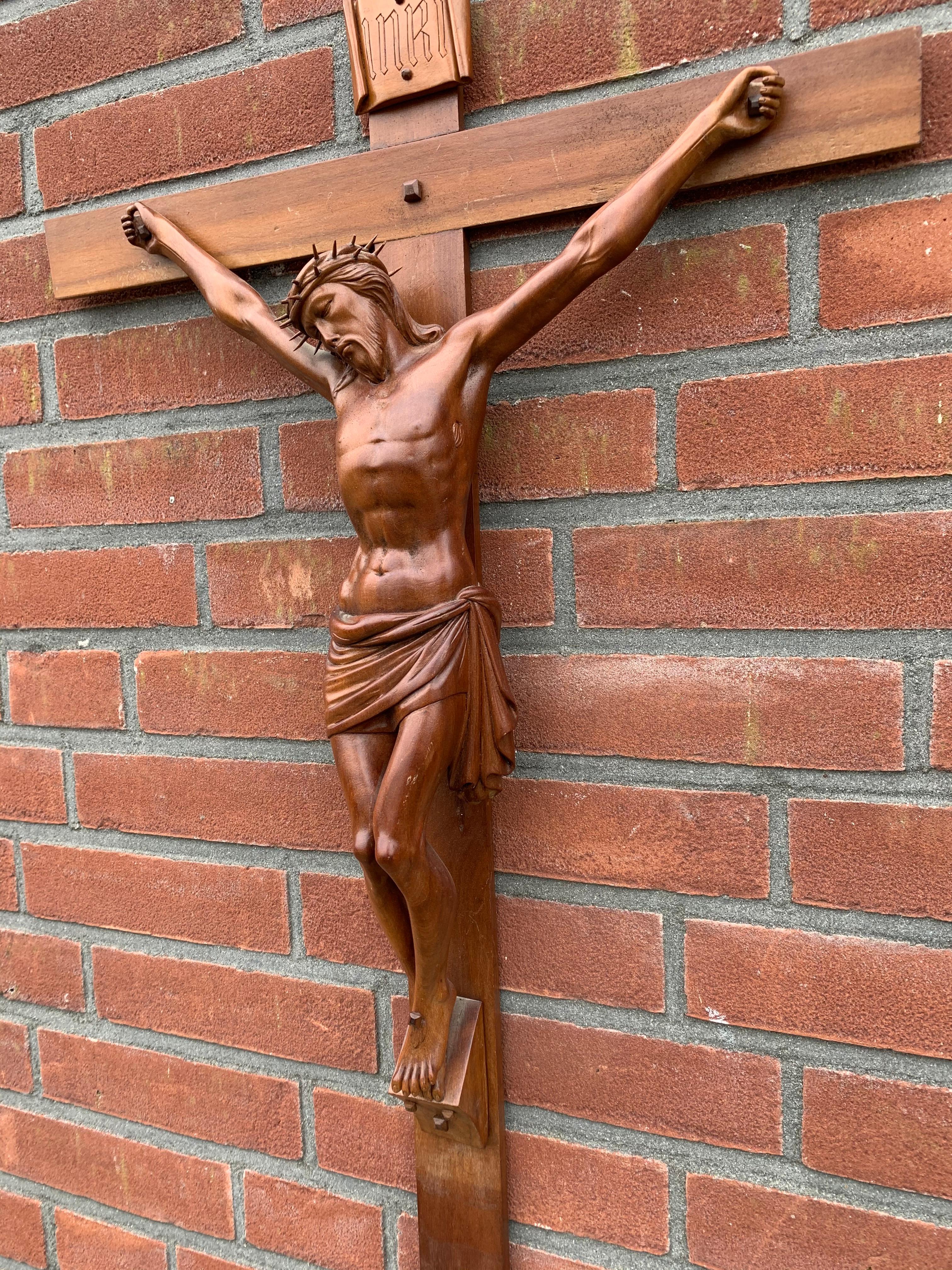 Sizeable crucifix with a quality carved corpus of Christ with unique facial features.

Looking at Christ suffering like this, the crucifix (in our view) is a symbol of what 'telling people the truth' can lead to. 'The truth does not have many
