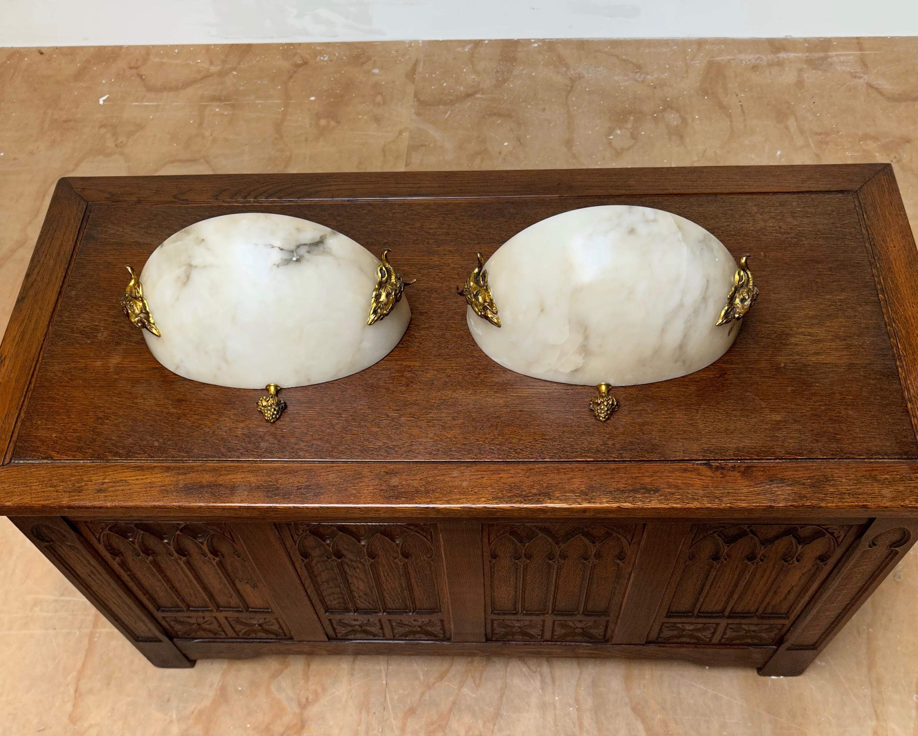 Rare, stylish and great quality pair of antique alabaster wall sconces.

This beautiful quality and impressive pair of gilt bronze and alabaster sconces truly is a rare find. We have sold many antique alabaster pendant lights, but as far as we can
