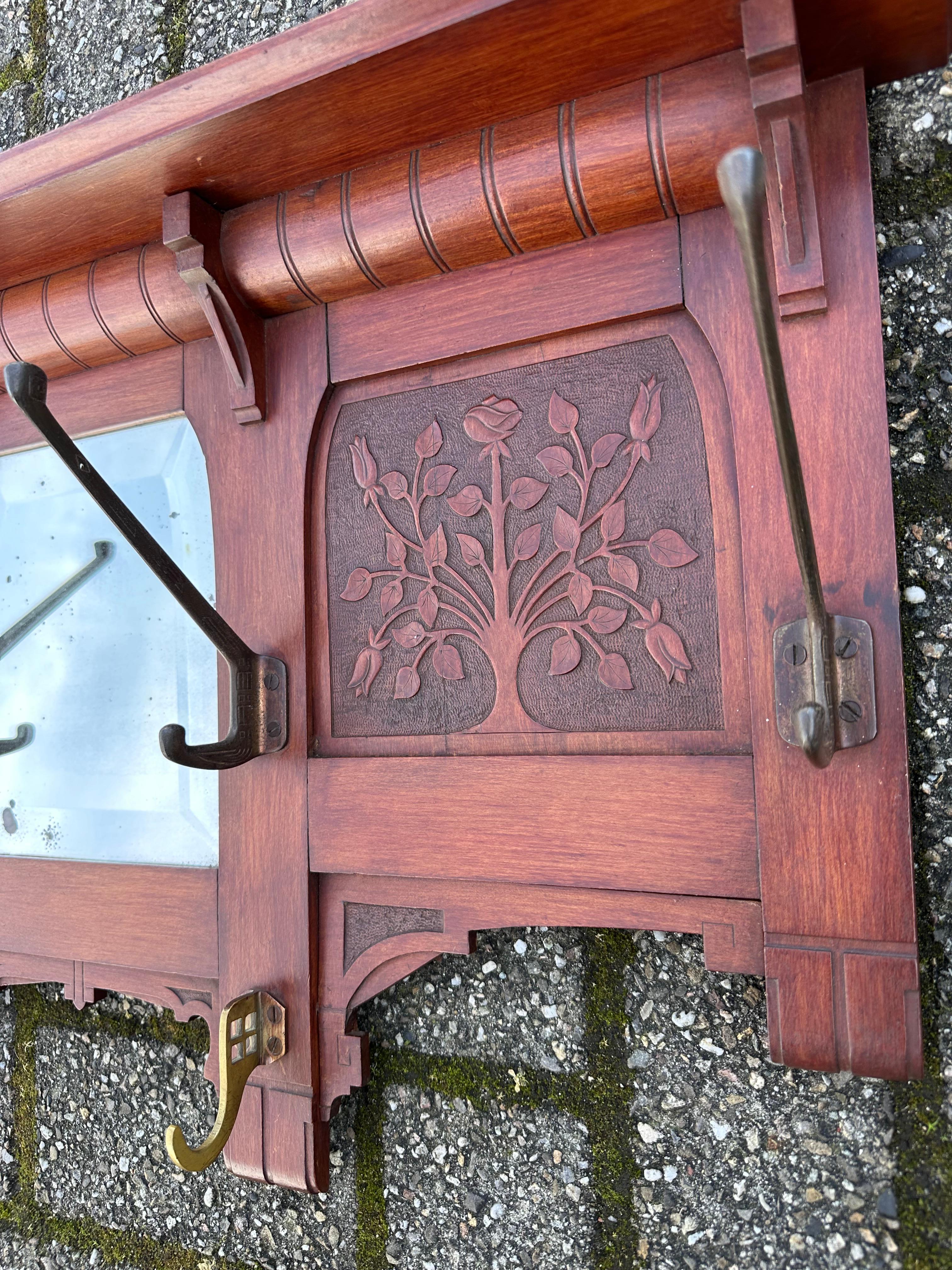 Early 1900 Arts & Crafts Coat Rack w. Carved Rose Bush Panels and Beveled Mirror In Good Condition For Sale In Lisse, NL