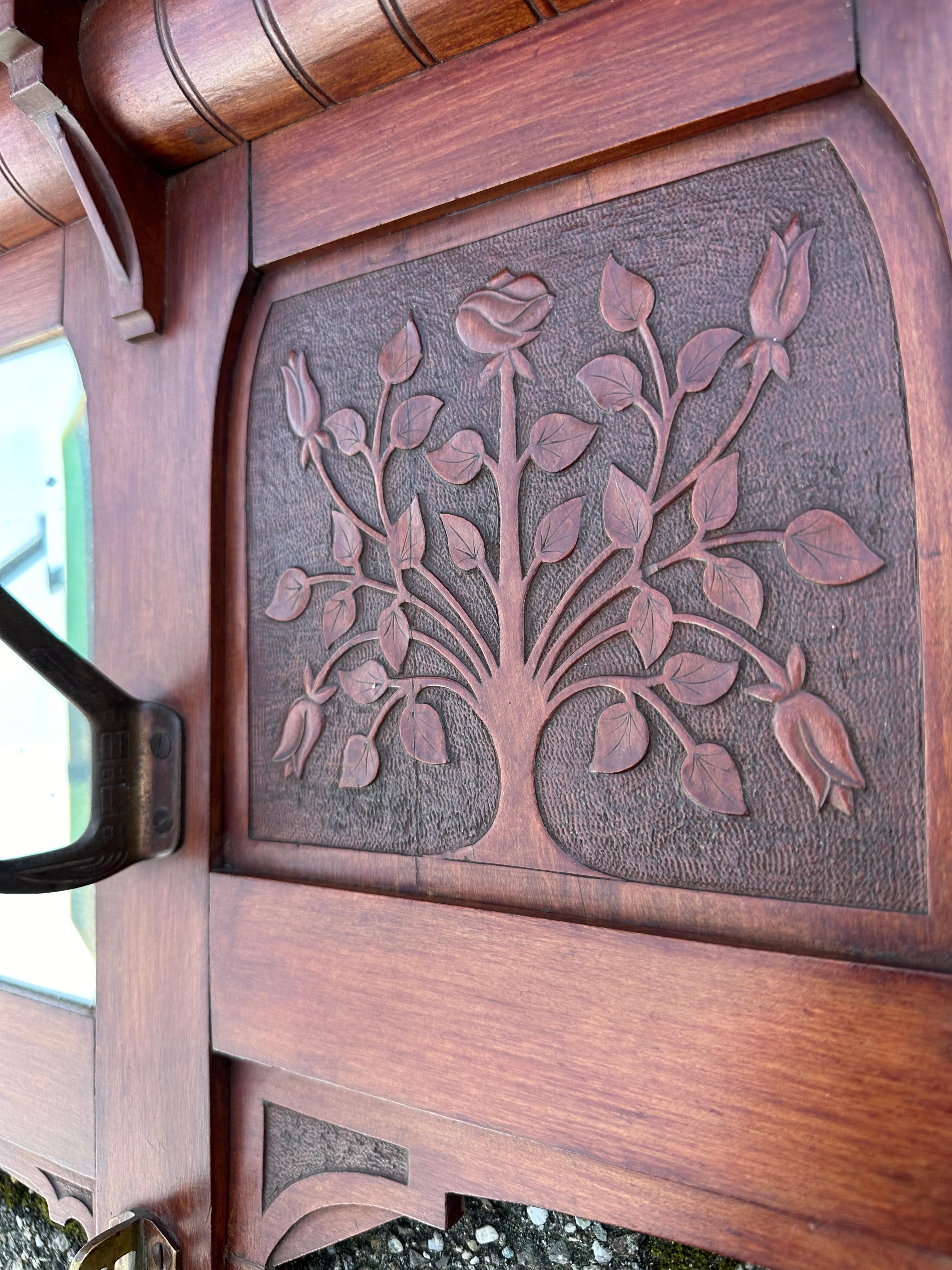 20th Century Early 1900 Arts & Crafts Coat Rack w. Carved Rose Bush Panels and Beveled Mirror For Sale