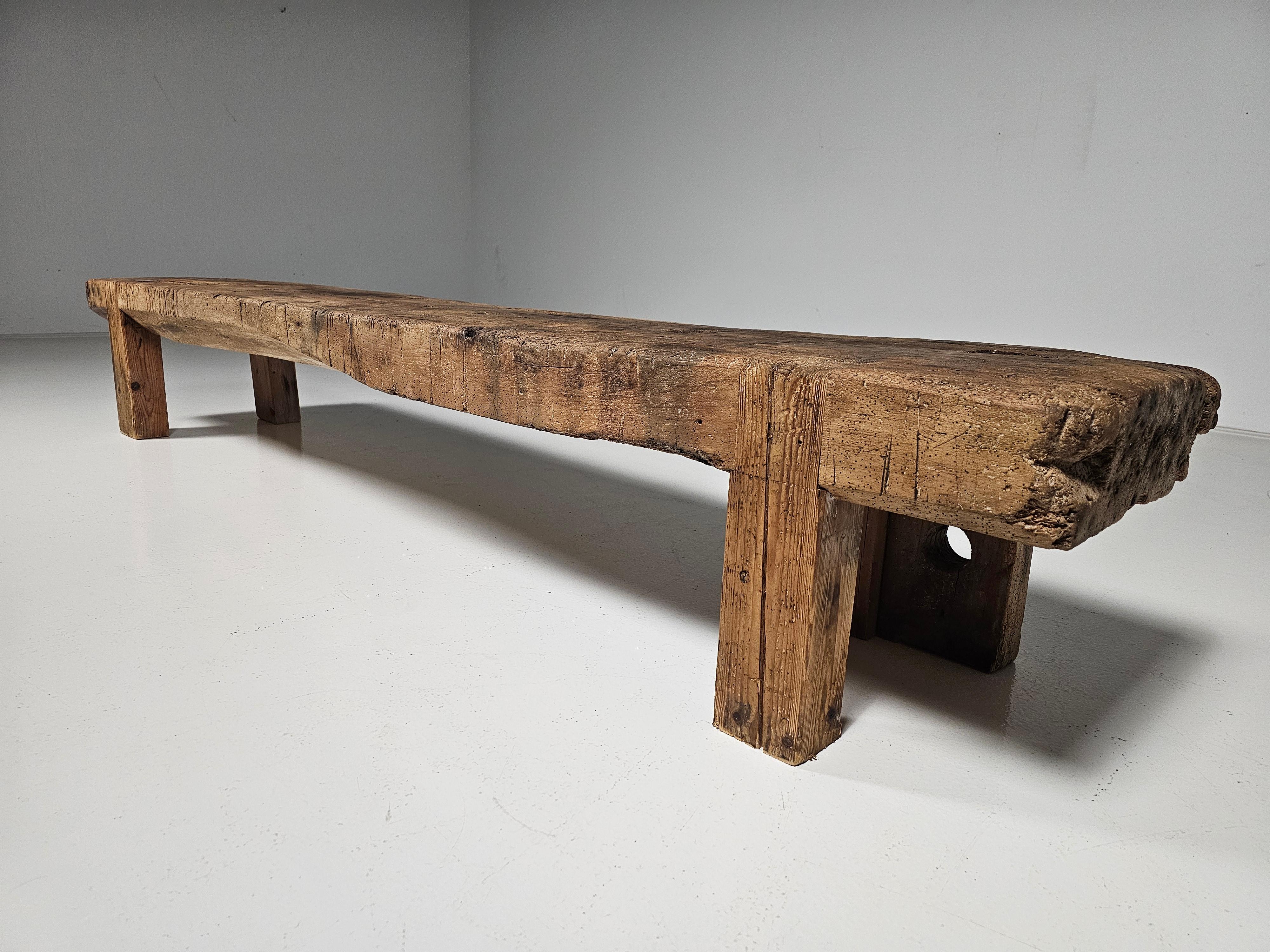 Solid pine wooden bench with long seat, France, the 1920s.

A superb primitive wabi-sabi wooden bench. A characterful piece in its original form, a wonderful natural piece with great texture and colour.

It has an elegant and beautiful silhouette in
