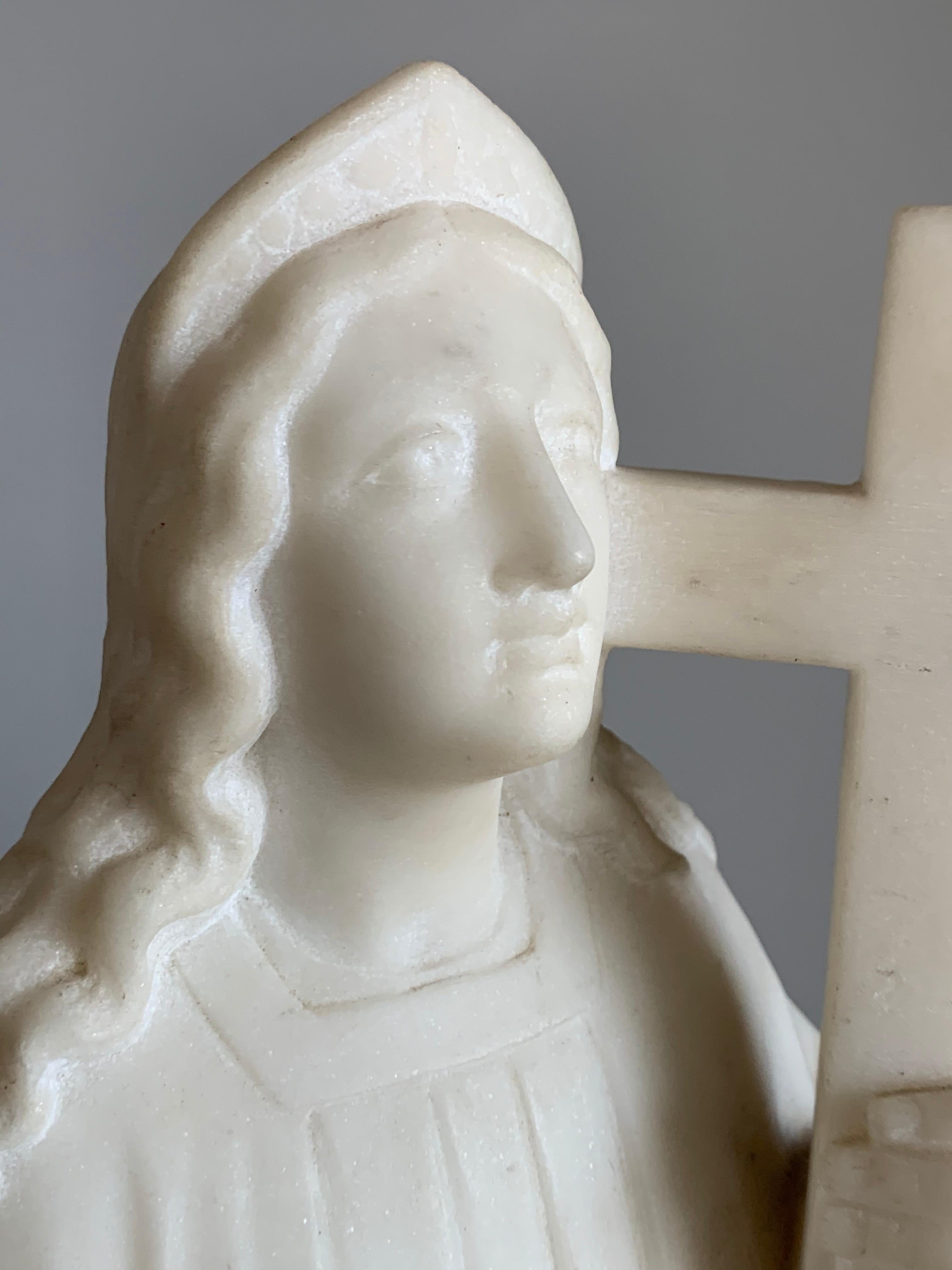 Beautiful antique and all handcrafted, solid Carrara marble sculpture.

This rare work of religious art is entirely hand carved out of white marble. We are not certain, but we feel that this striking sculpture depicts Mother Mary. Her kind and