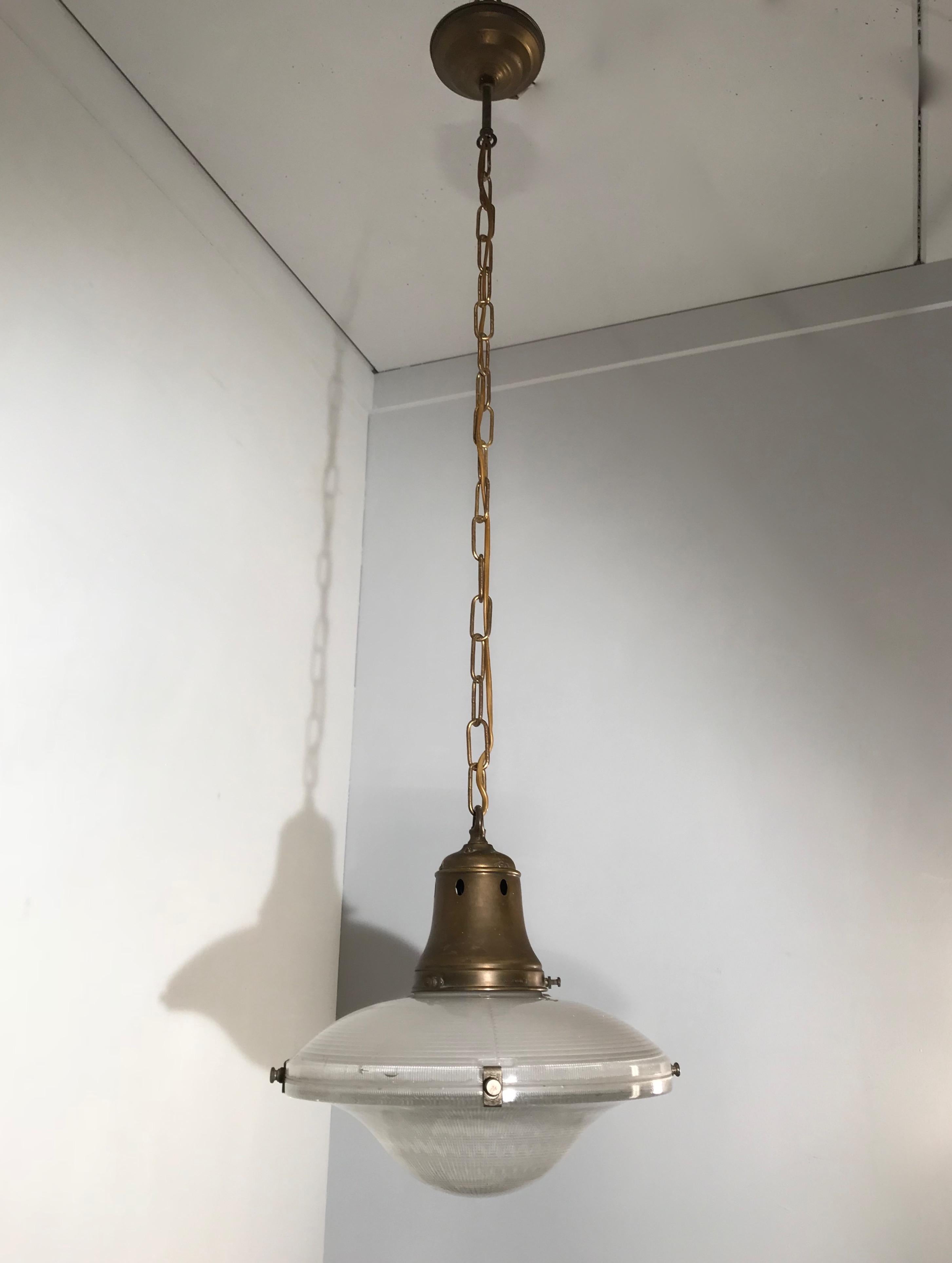 Stylish and museum condition Holophane pendant.

It does not matter whether you are decorating an Art Deco, a Mid-Century Modern or a contemporary home or office, if you have the right space then this stunning, timeless and practical size Holophane