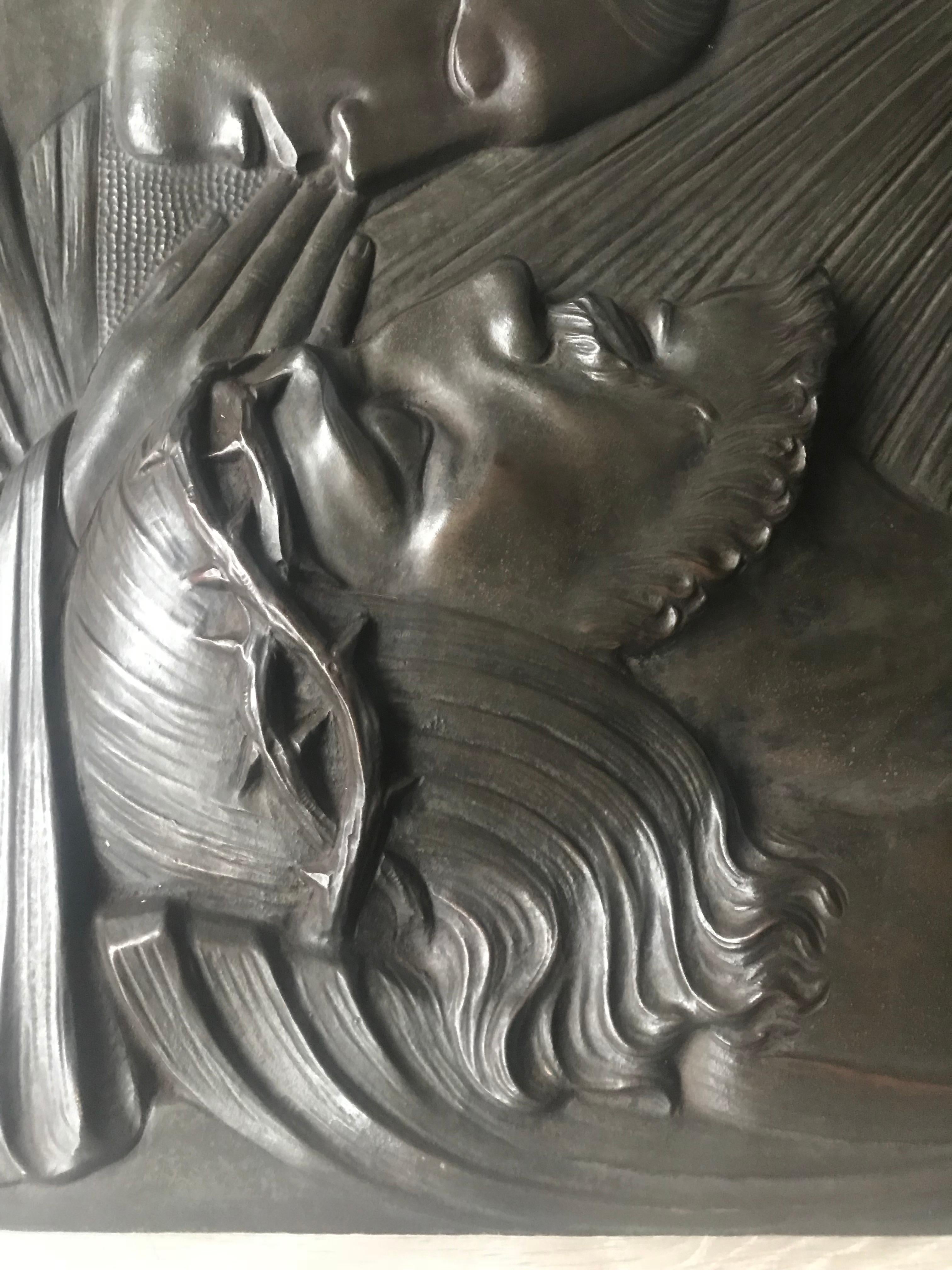 Large and heavy Art Deco bronze wall sculpture of the pieta by Silvain Norga

This large bronze wall plaque depicts the Virgin Mary praying over the body of Jesus Christ after the Crucifixion. The typical Art Deco hairstyle of Mother Mary and the