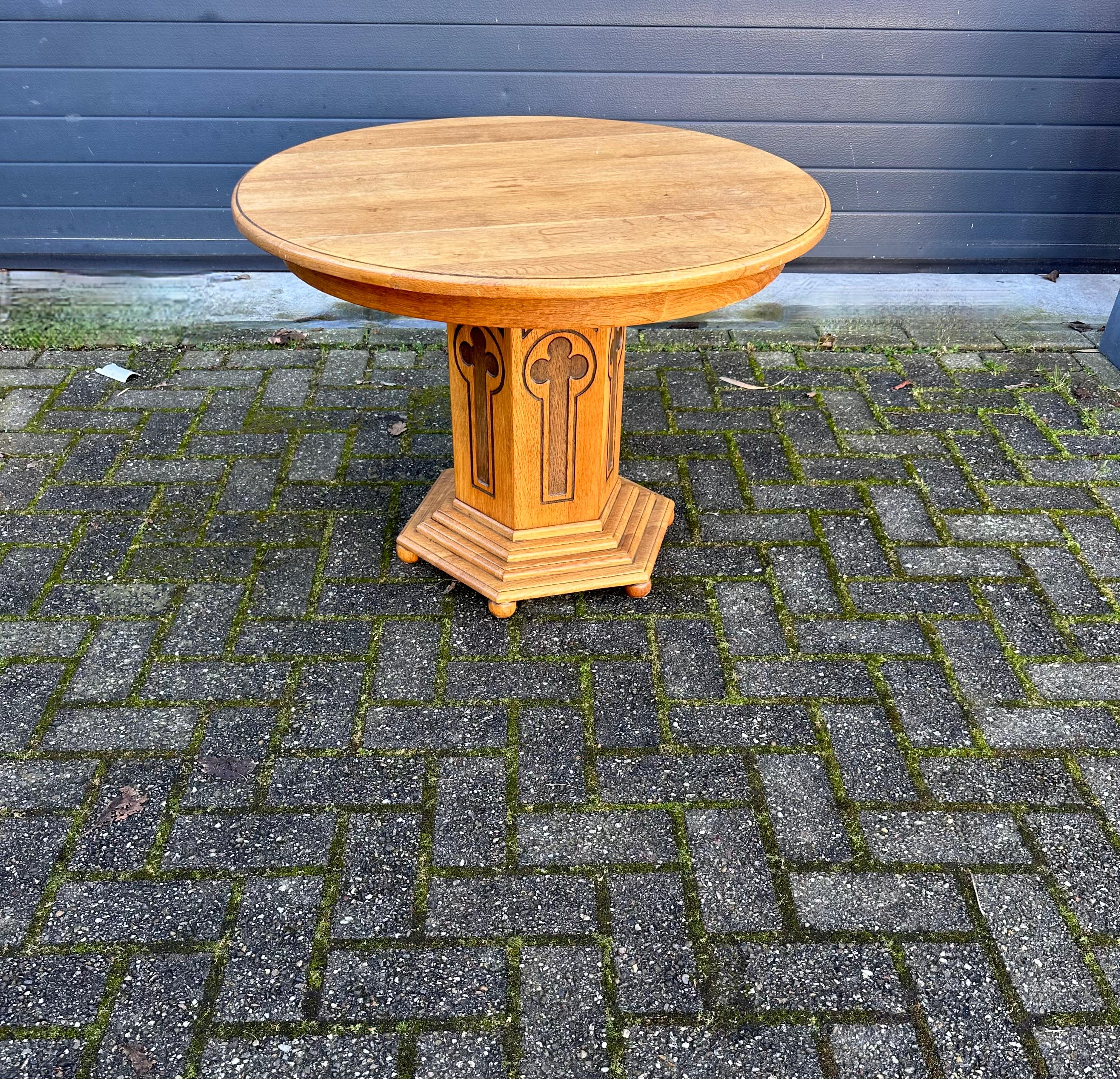 Beautiful and practical, one of a kind Gothic table with layered base.

This handcrafted antique has a beautiful patina and this piece radiates nothing but quality, stability and durability. All hand-crafted out of solid oak only and with a strong