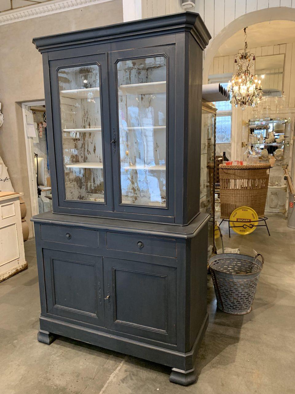 Handsome French 2-part display cabinet. An ideal design for storing crockery and glasses. This lovely piece consists of a display unit with doors in original old glass, and the lower section has doors and 2 spacious drawers. The cabinet is painted