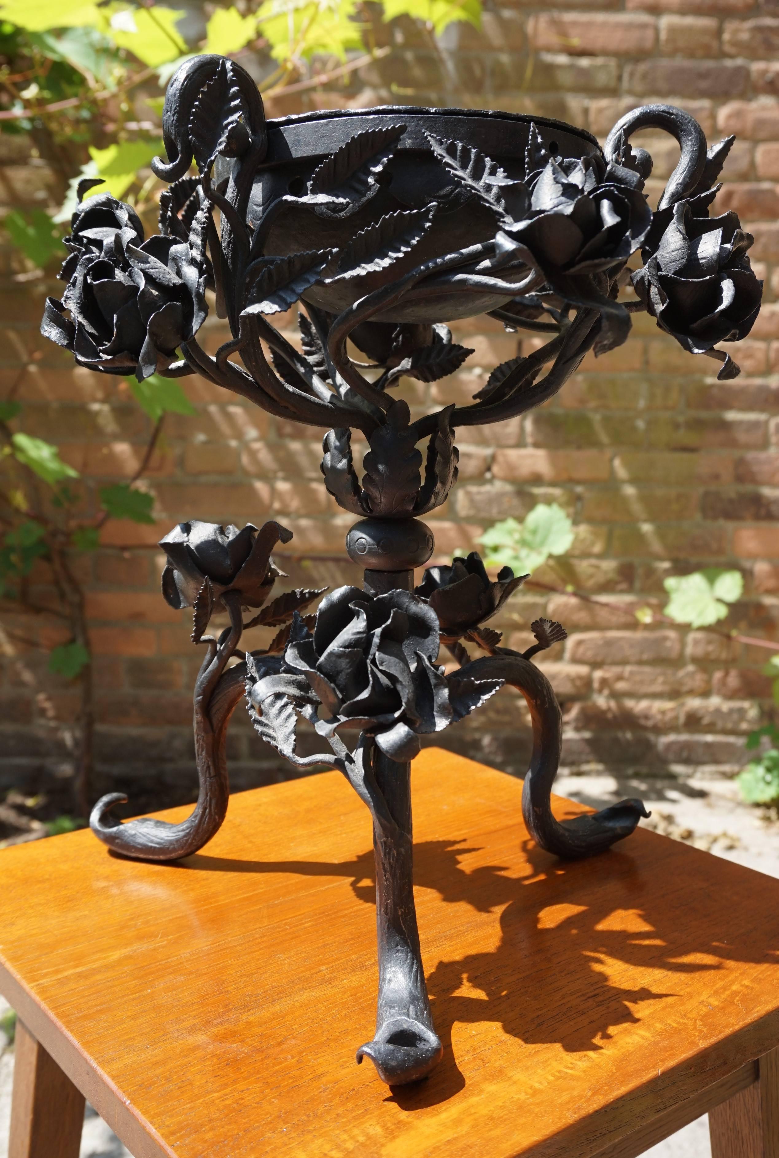 Hand-forged with fine quality roses centrepiece.

Because of the many different and detailed roses and the demountable, hand-hammered bowl on top, we have nicknamed this antique 'the rose bowl'. Although we cannot know for sure, we believe that this