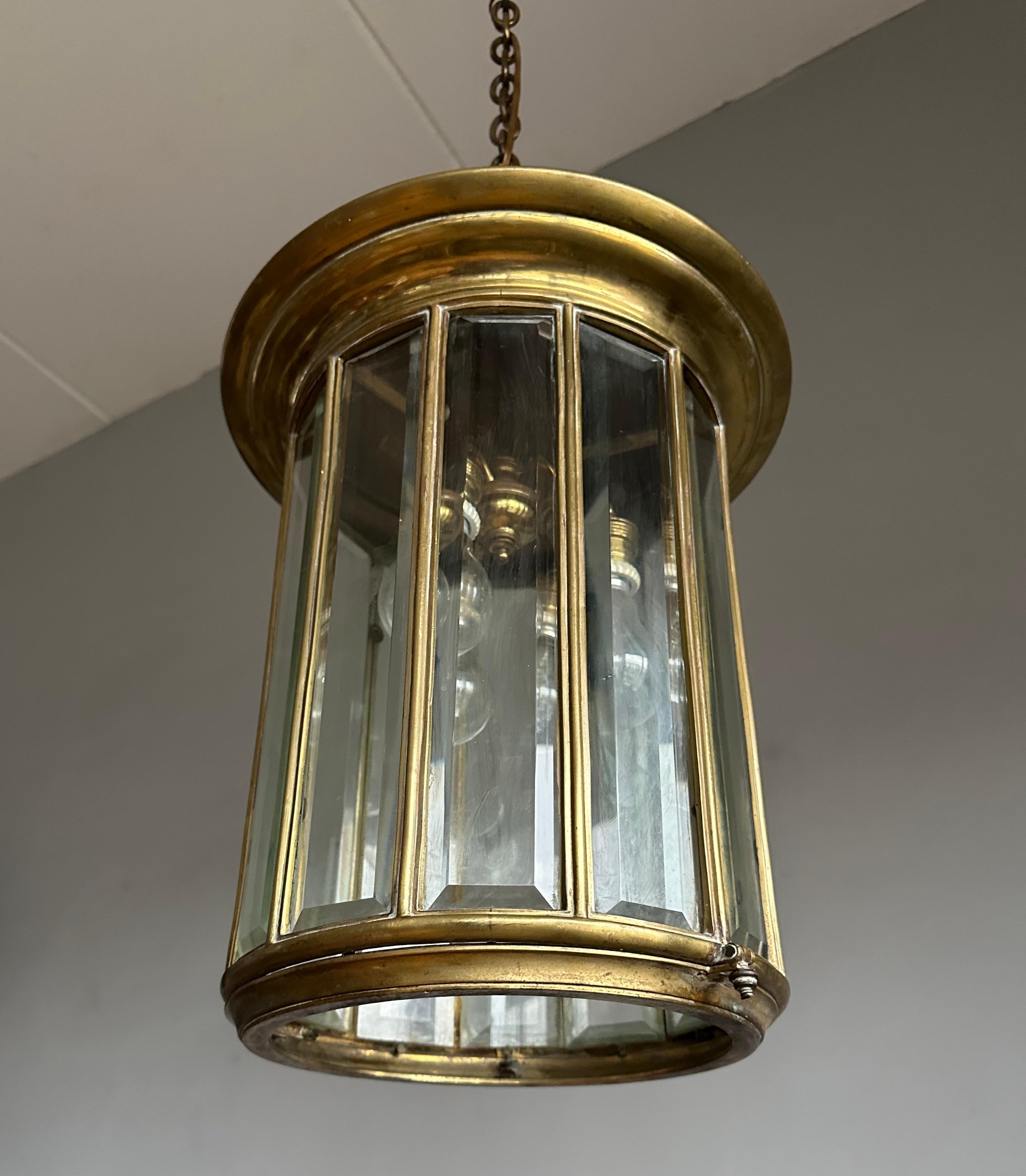 Large and all handcrafted Art Deco pendant with 12 thick transparent beveled glass window panels and dome top. 

If you live in an early 1900s Arts and Crafts home or if you are a collector of unique and stylish home accessories from that era then