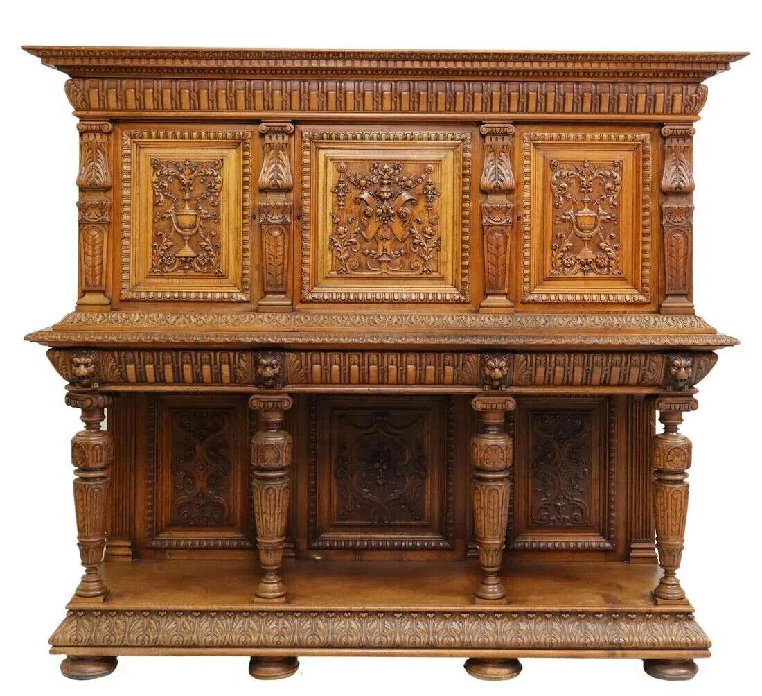 Gorgeous Antique Sideboard, French Renaissance Style, Carved Walnut, early 1900s, 20th century!!

French Renaissance style walnut sideboard/ cupboard, 20th century, molded cornice and frieze, three cabinet doors with lion's mask, fruit, urns,