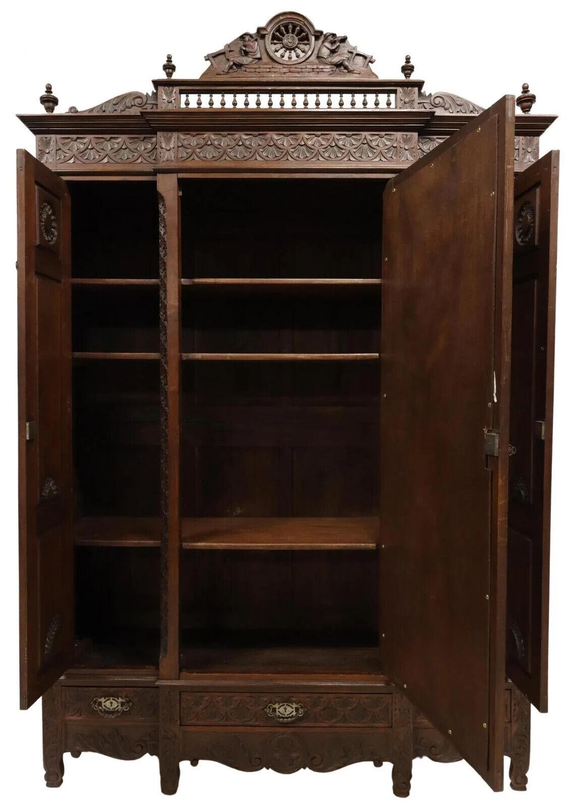 Early 1900s Antique Triple, French Breton, Carved Oak, Mirrored Armoire In Good Condition In Austin, TX
