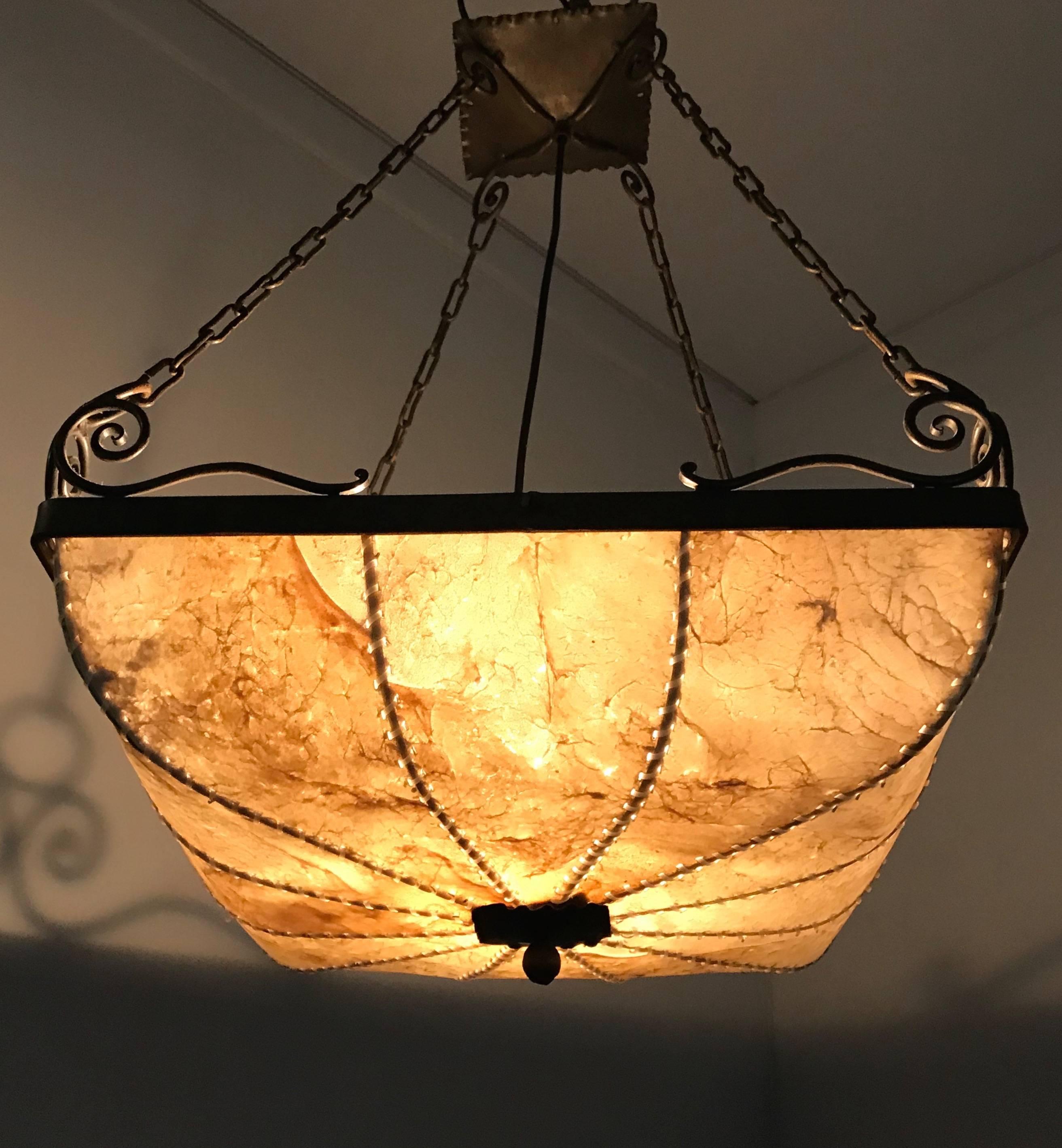 Stylish and all handcrafted Arts & Crafts pendant. 

If you are looking for stylish and out of the ordinary light fixtures then we herewith offer you another possibility to acquire just that. This square model pendant is entirely handcrafted and
